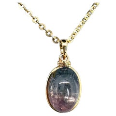 Parti-colored upcycled tourmaline cabochon and 14k yellow gold pendant necklace 