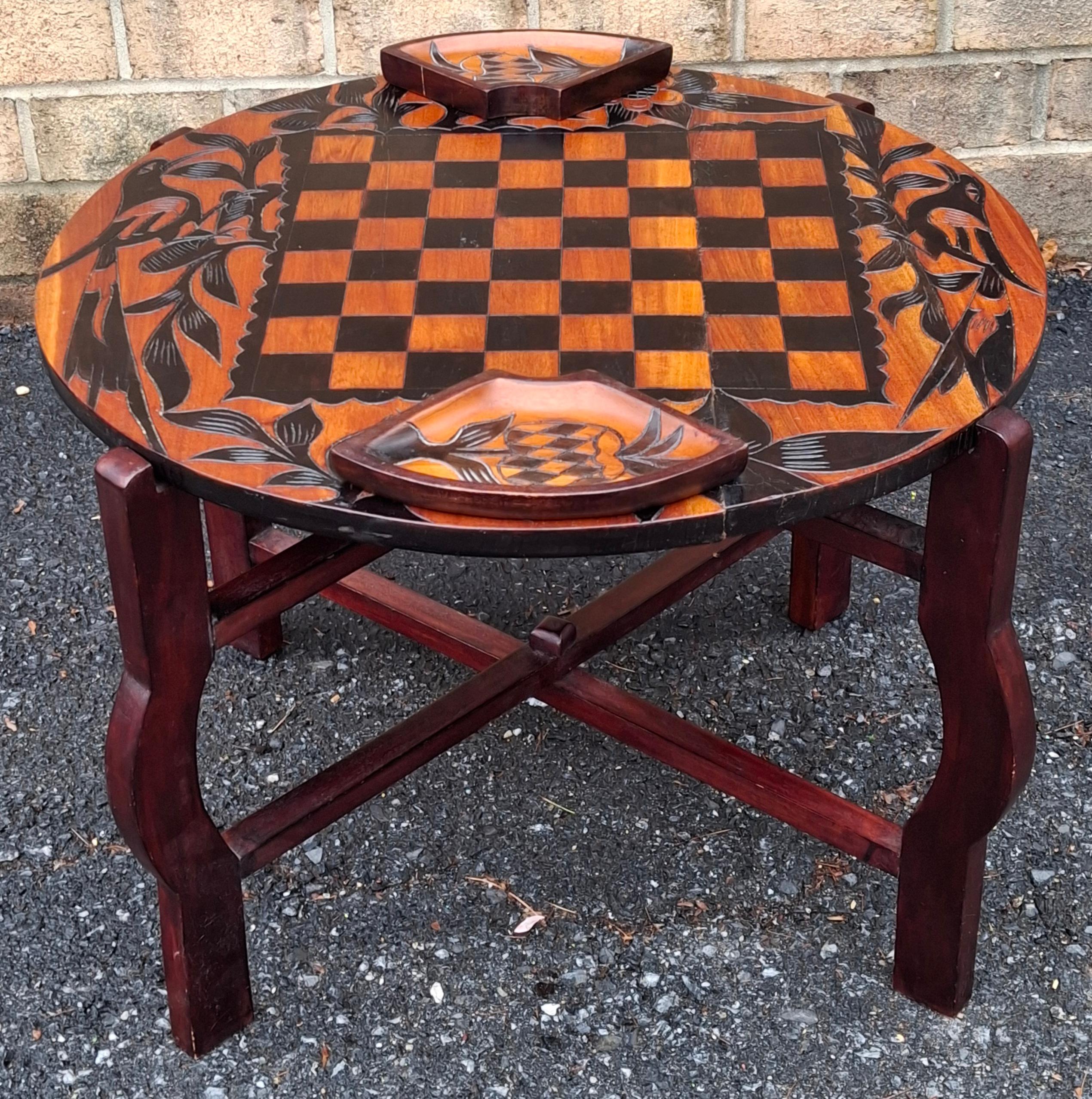 A Partial Ebonized Carved Wood Double Sided Game Table on Folding Stand.  
Measures 24.5