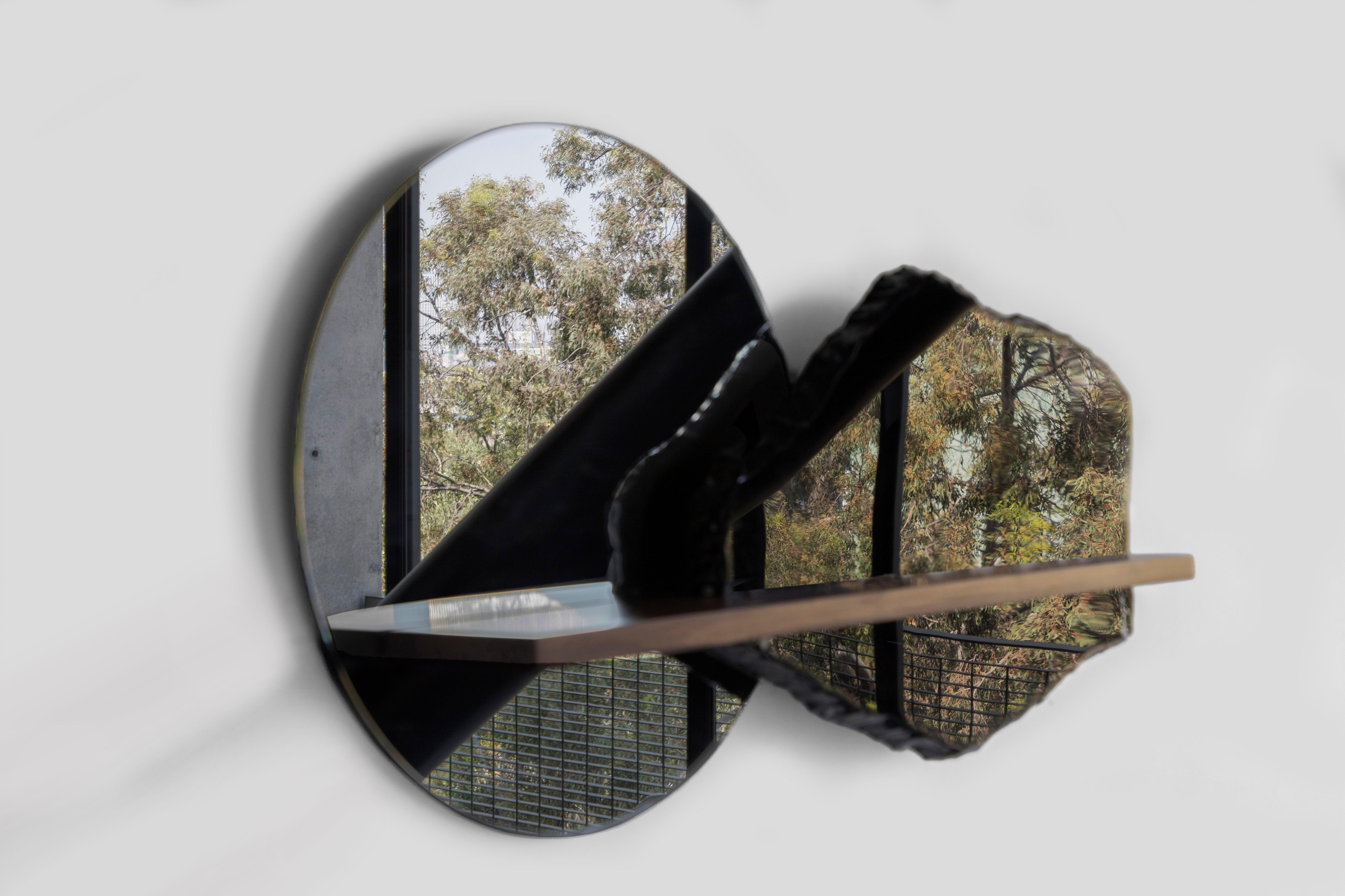 Obsidian, mirror and walnut
Collaboration with FOAM studio
Handcrafted

The central metaphor of this piece is achieved thanks to a material contrast in which the perceived coldness of obsidian and the mirror creates a dialogue with the warmth of the