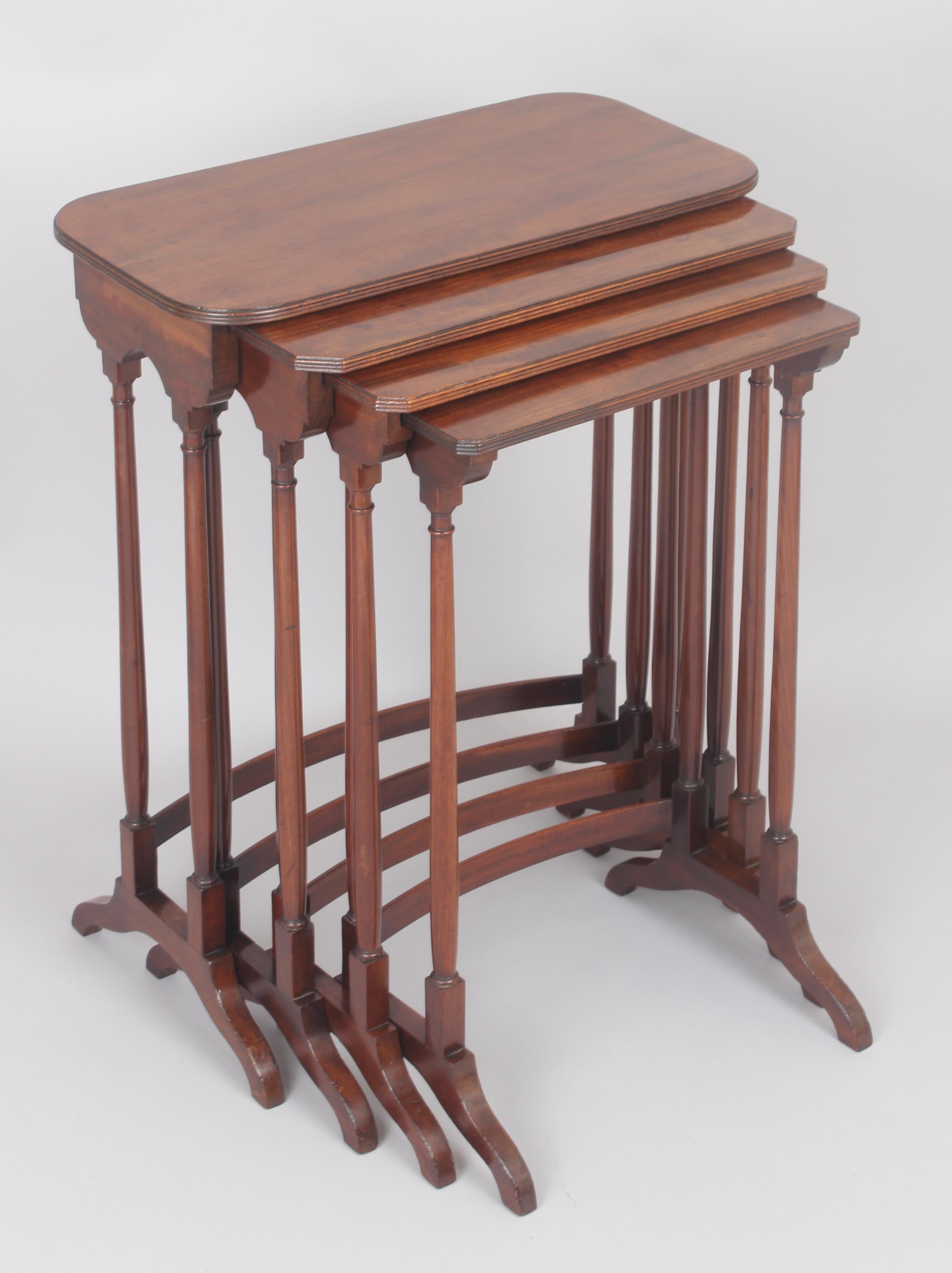 A particularly fine and high quality George III period mahogany set of quartetto tables. High quality timber, the tops with rounded and angled corners, and reeded edges. Mounted on slender turned legs united by beautifully bowed stretchers.