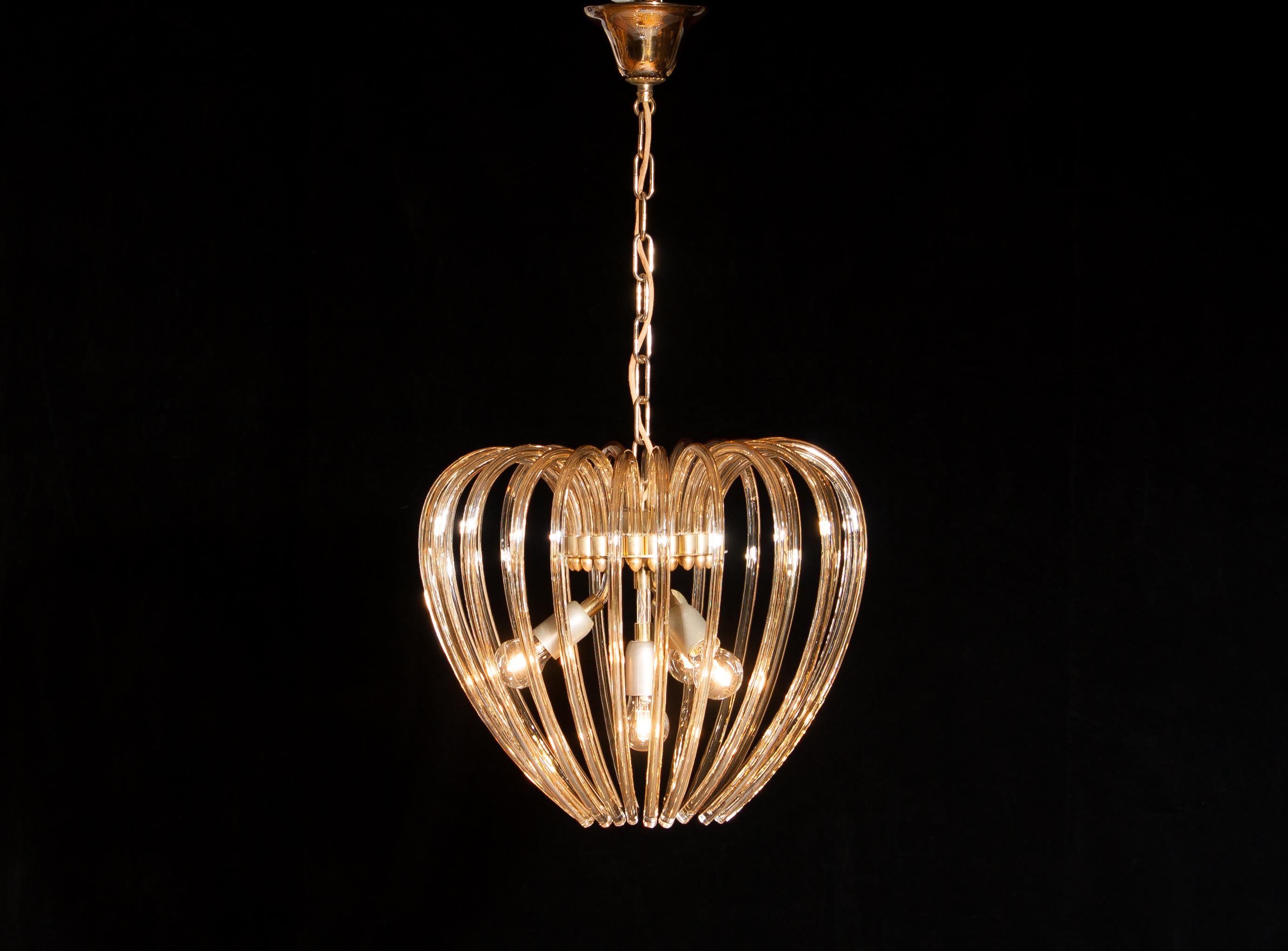 Lovely chandelier by Murano, Italy.
This lamp has a beautiful heart shape made of gilded crystal elements.
It is in excellent condition.
Period 1960s.
Dimension: Total height 90cm, ø 50 cm.