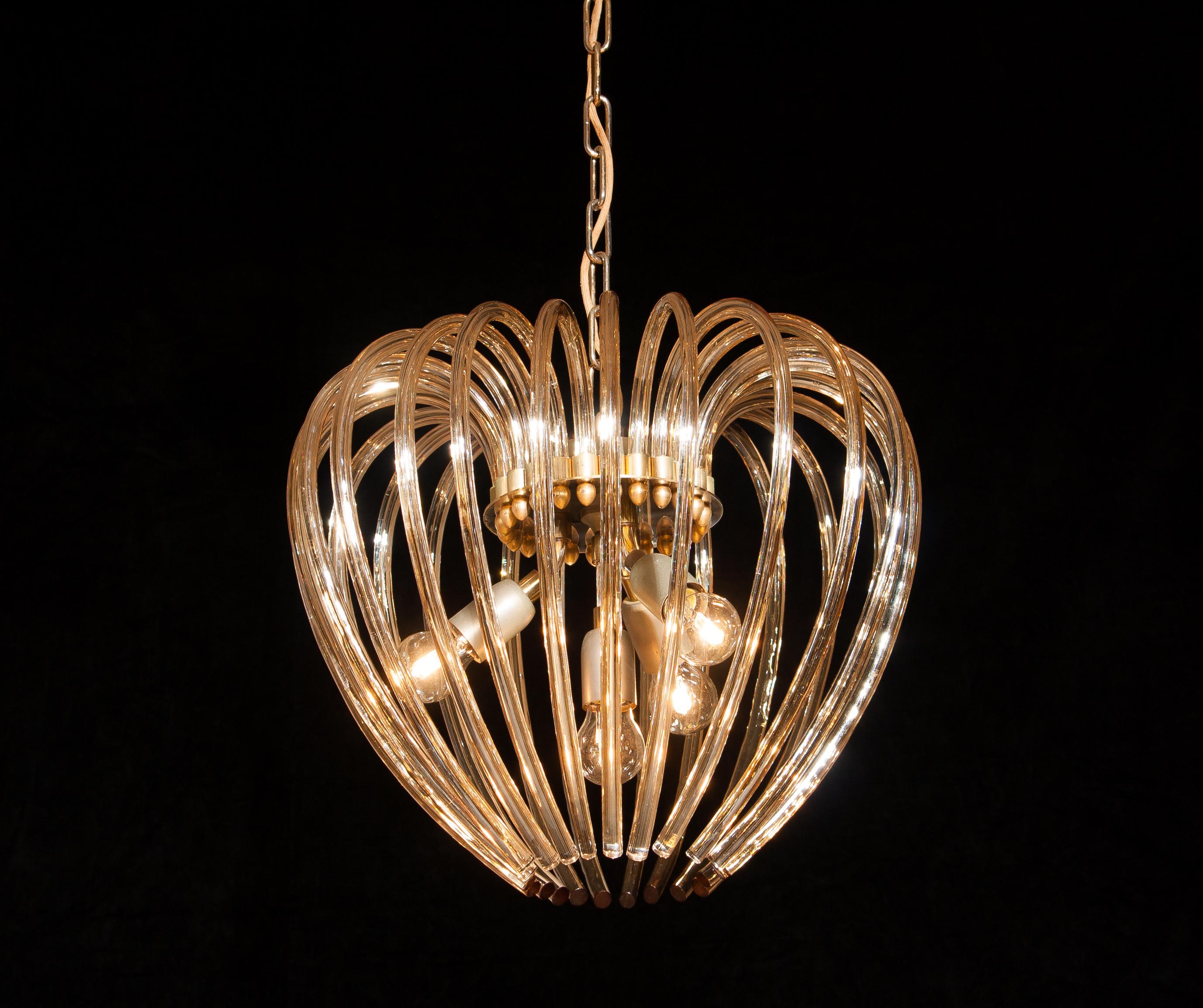 Lovely chandelier by Murano, Italy.
This lamp has a beautiful heart shape made of gilded crystal elements.
It is in excellent condition.
Period 1960s.
Dimension: Total height 90cm, ø 50 cm.