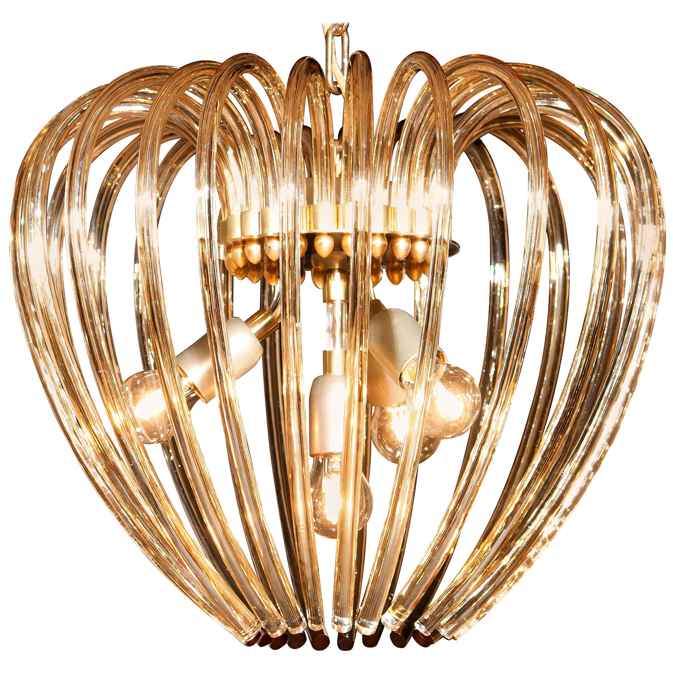 Lovely chandelier by Murano, Italy.
This lamp has a beautiful heart shape made of gilded crystal elements.
It is in excellent condition.
Period 1960s.
Dimension: Total height 90cm, ø 50 cm.