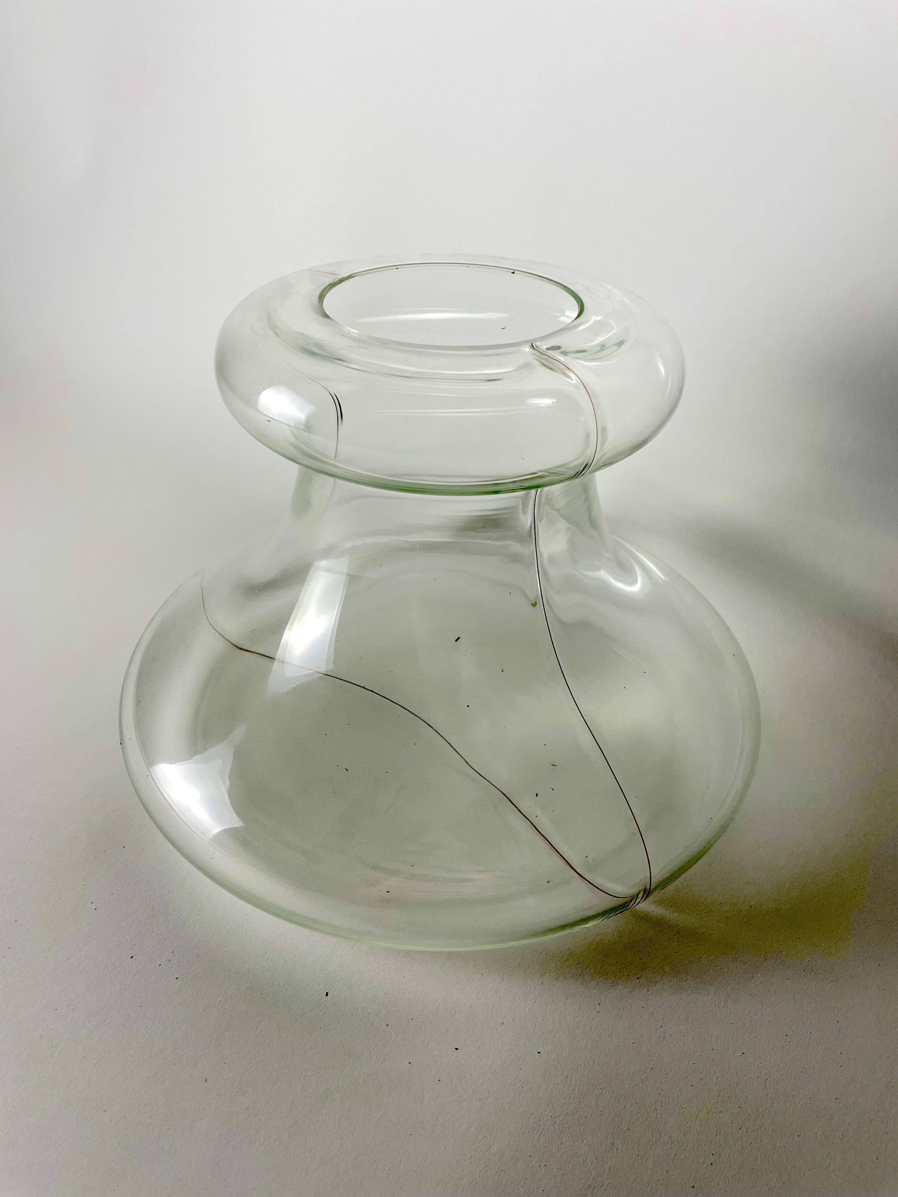 Bask in the splendor of 'PARTY', an exquisite piece of craftsmanship from designer Renato Toso for Fratelli Toso. This crystal hand-blown glass, worked and decorated freehand, is a stunning testament to the minimalistic philosophy in design. A