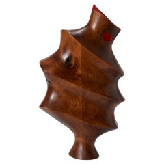 Parul 0.1, a walnut ribbed abstract sculpture with red interior by Donald Baugh