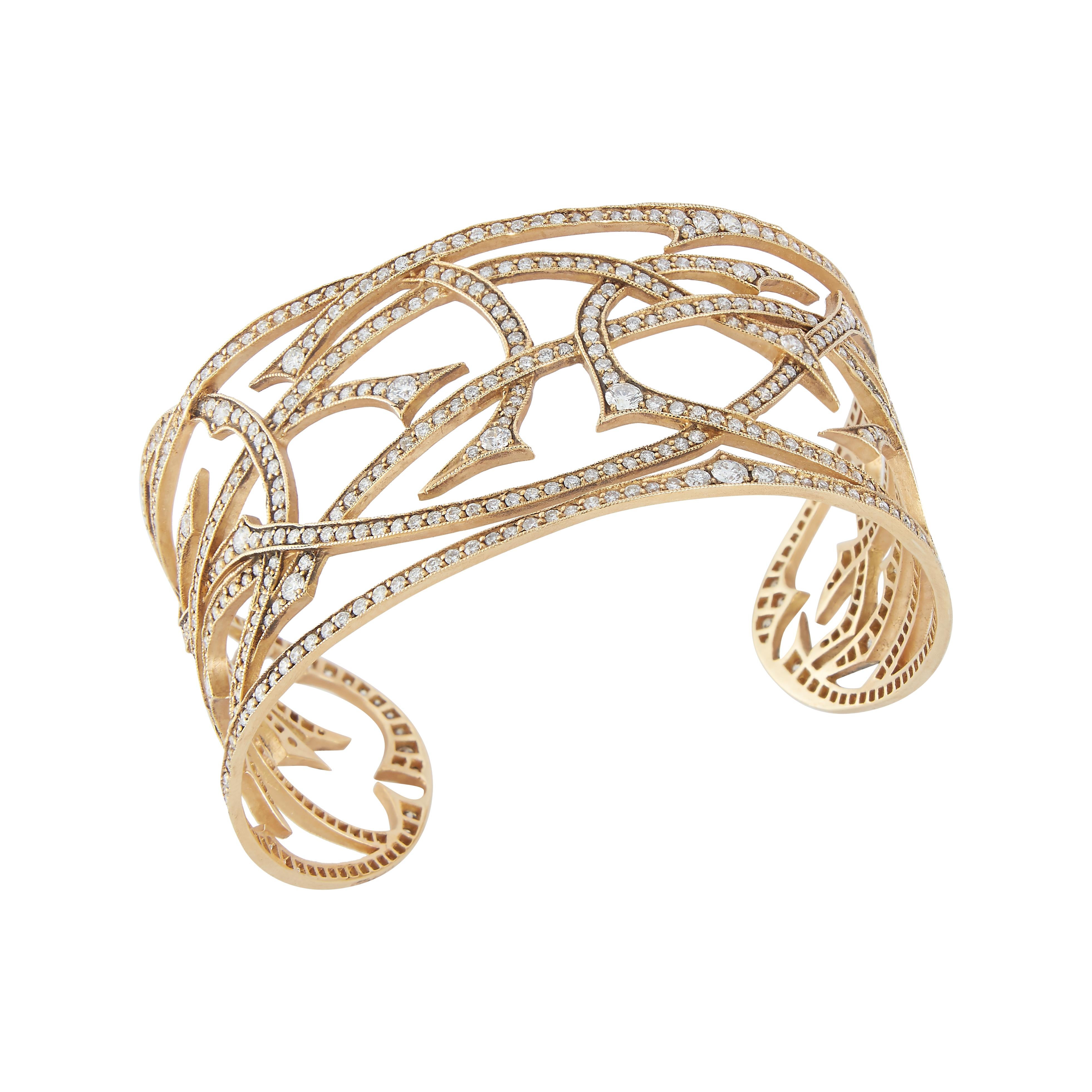 Parulina Couture Fine Jewelry-Small Vines Diamond Cuff from the Briar Rose Collection.
This diamond cuff from Parulina features stunning 18k yellow gold with an impressive 6.22ct of round brilliant cut diamonds.
2.5 inch inside diameter.

Metal: 18K