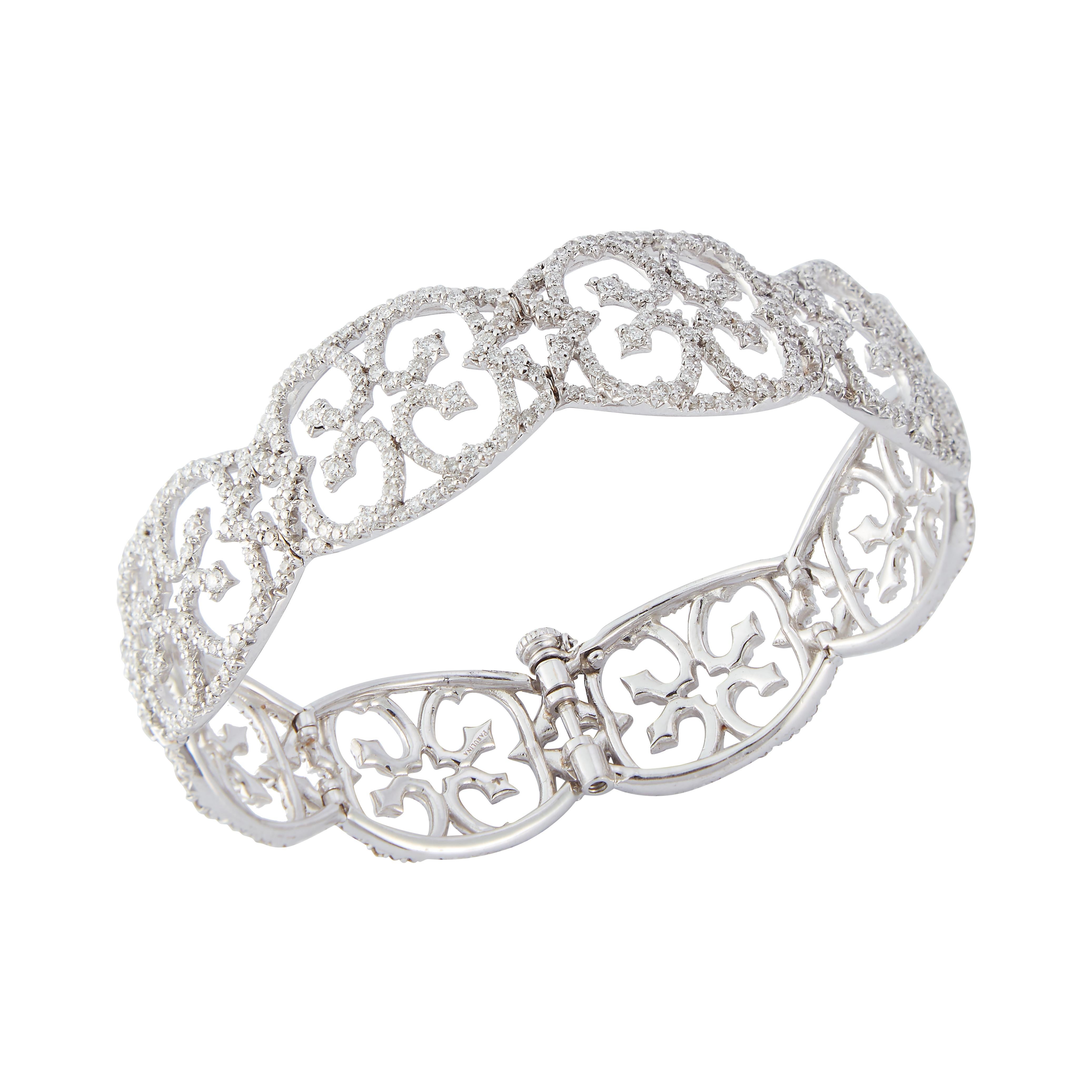 Parulina Couture Fine Jewelry- Diamond Cuff in 18K White Gold. 
Total diamond weight of 8.53ct
Bracelet has a wide opening that will accommodate fitting most wrists.

Metal: 18K White Gold
Carat Weight: 8.53