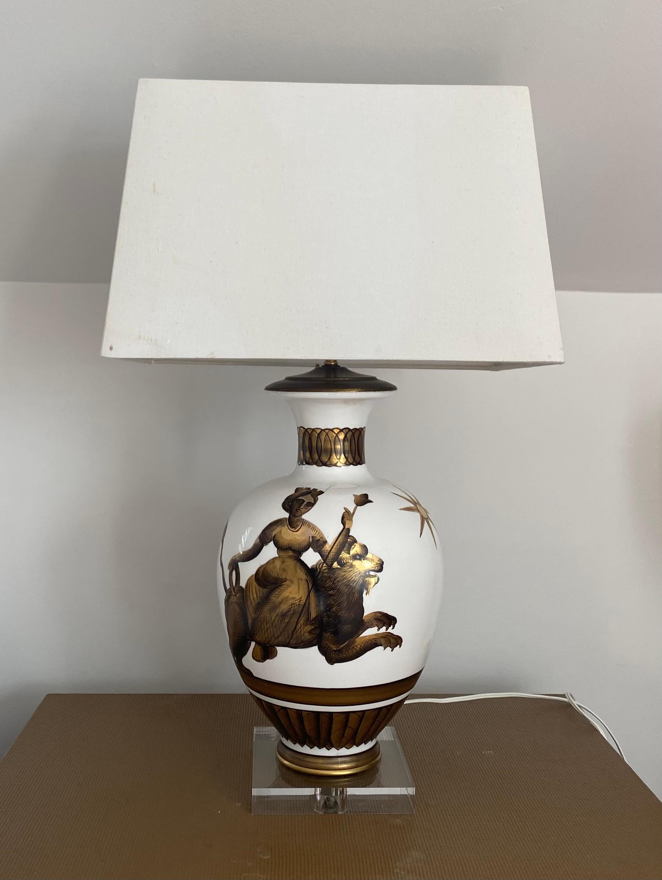 Parzinger milk glass lamps painted with classical figures.
Plexiglass base for a modern look.


Dimensions
9 inches widest diameter - 17 inches high plus 10 inch shade for total of 27 inches high