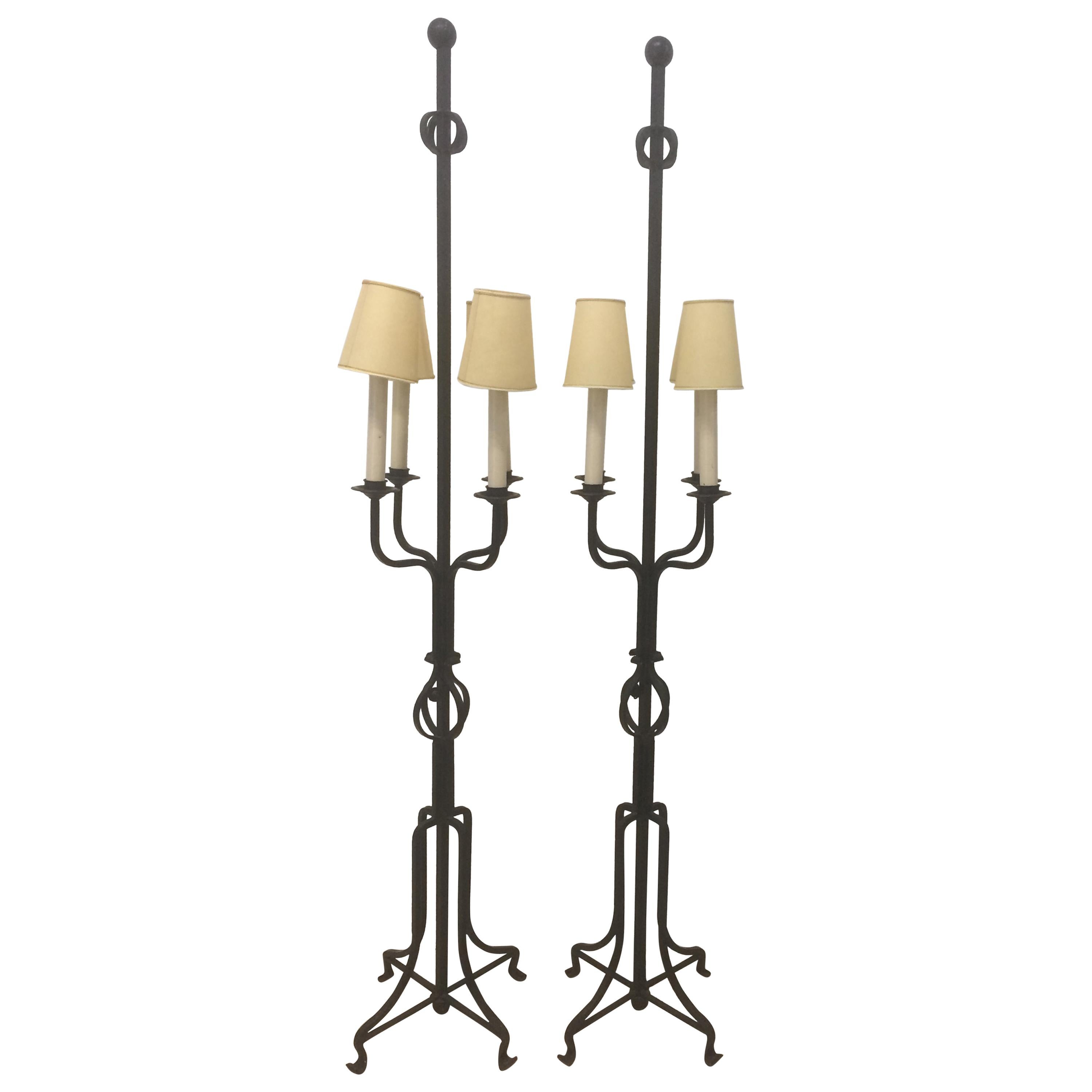 A pair of black wrought iron swing arm floor lamps at 1stDibs black