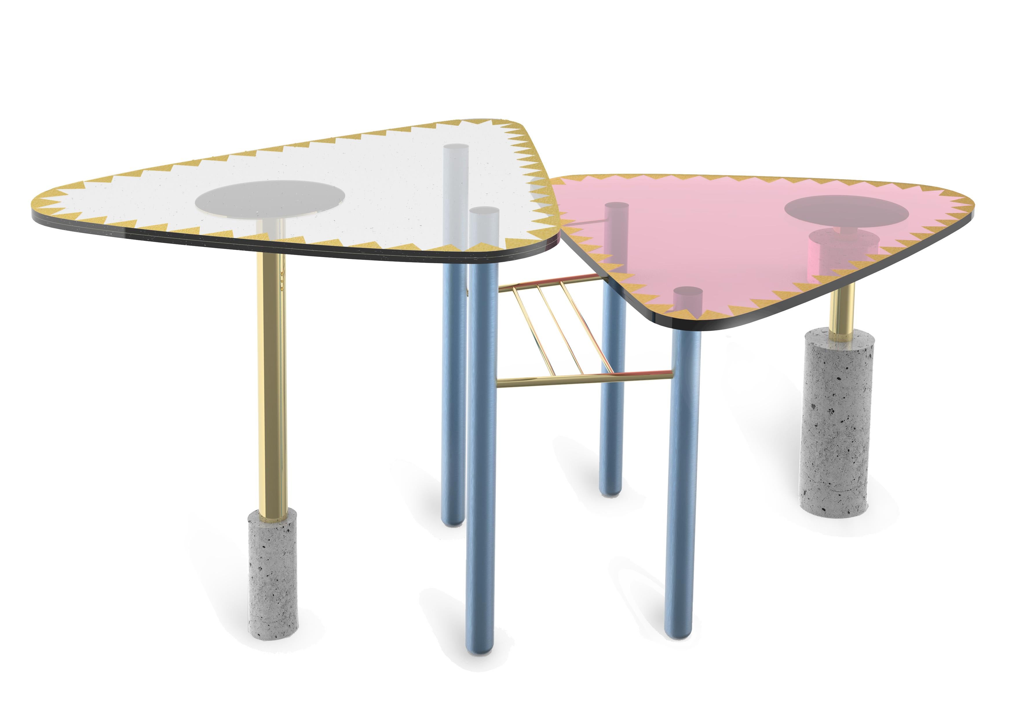 Pas-Table by Sema Topaloglu. 
Colorated glass table top is layered-laminated.
Small-brass triangle thin pieces are layered with color PVB films between 2 glass surfaces. 
Each glass thickness 1 cm Brass-pieces are difused in glass layers and with