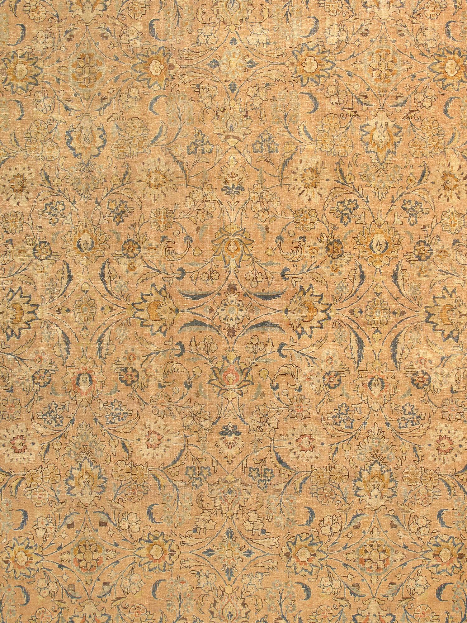 This stunning Antique Persian Tabriz is distinguished by it's excellent weave and by it's remarkable adherence to the classical traditions of antique rug design. Add a magnificent accent to your home with this magnificent piece. With each rug in