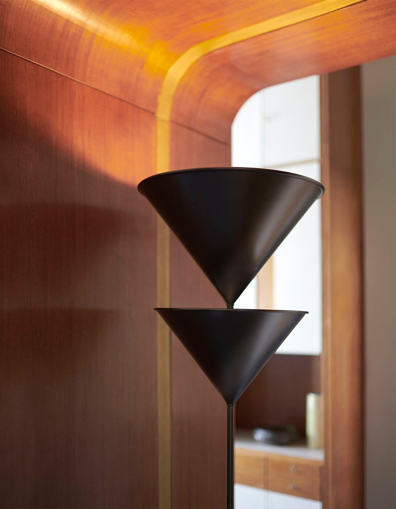 Pascal floor lamp by Vico Magistretti for Oluce. Originally designed in Italy, 1983. Oluce's newest offering of this model comes in plated, anodized bronze. This is a current edition floor lamp giving indirect and reflected light with an independent