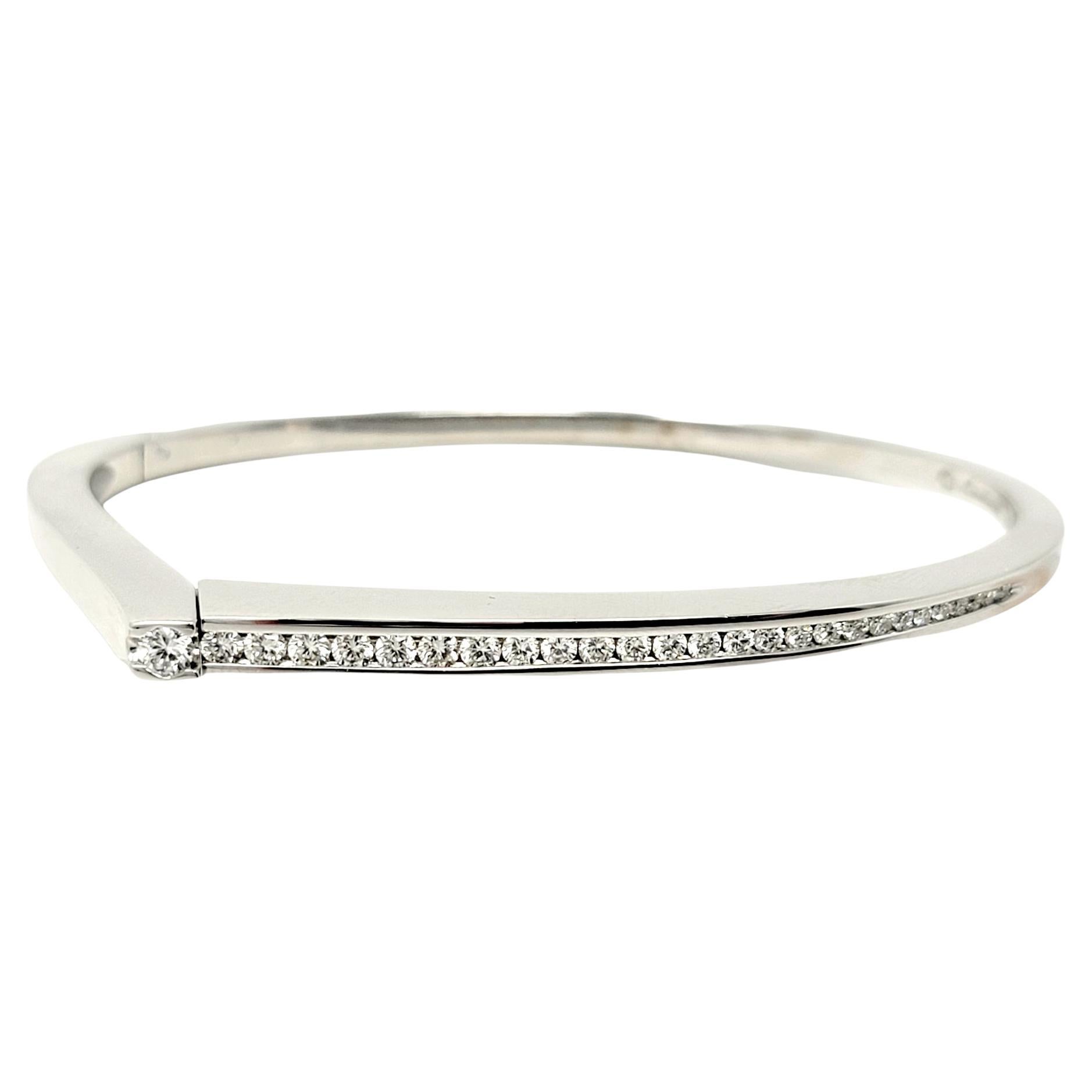 Stunningly sleek contemporary diamond bangle bracelet handmade by French jewelry designer, Pascal Lacroix. Part of his Riviera collection, this elegant bracelet absolutely shines on the wrist, sparkling from every angle. The 27 graduated natural