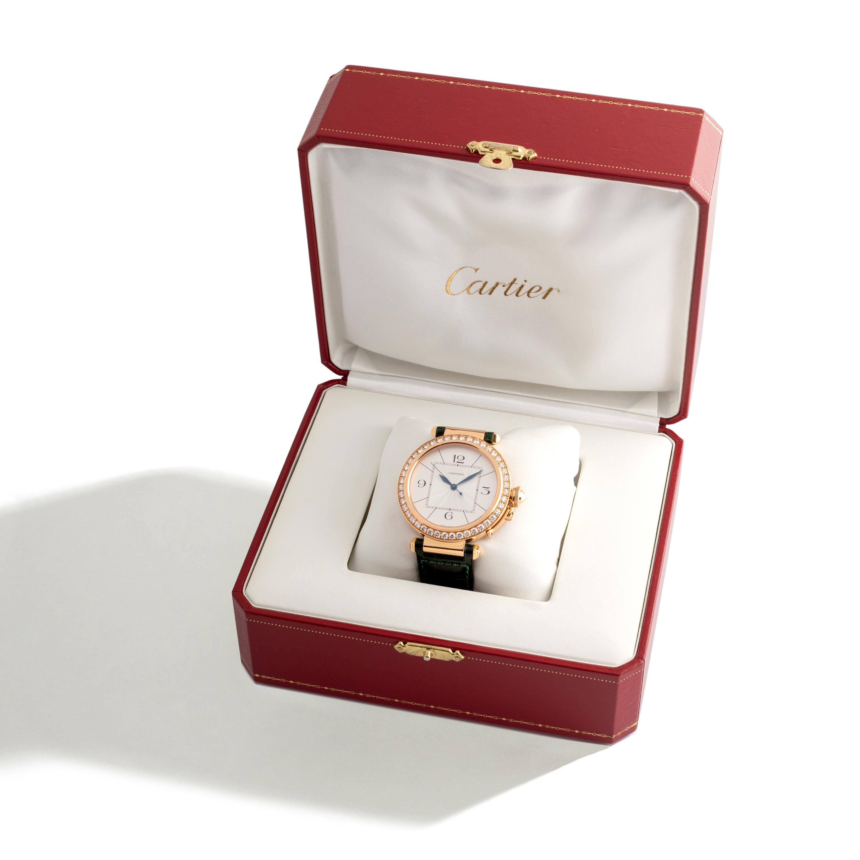 Pasha Cartier Diamond and Gold Wristwatch.
Unisex 18k Yellow Gold Diamond Bezel 42mm.
Three leather Bracelets Green, Yellow, Chocolate.
Original Cartier Box.
Original Cartier Certificate.