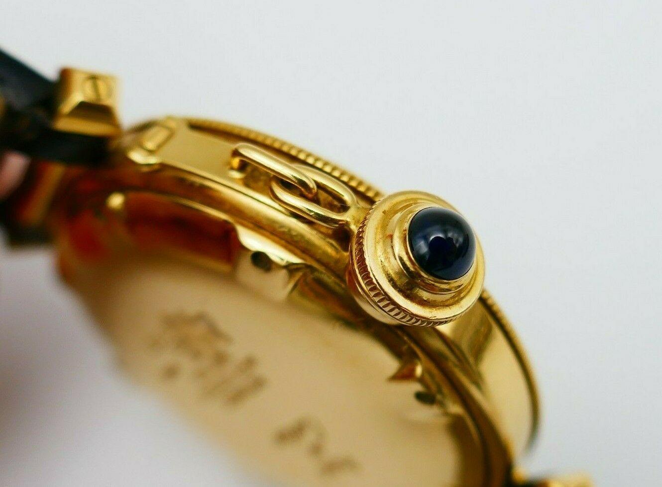 A Swiss made Pasha de Cartier Yellow Gold 1020 watch with an automatic movement. 
An ivory-colored dial features black Arabic numbers, date aperture at five o’clock, and blued hands made with luminescent material. Has the screw-down crown cover. The