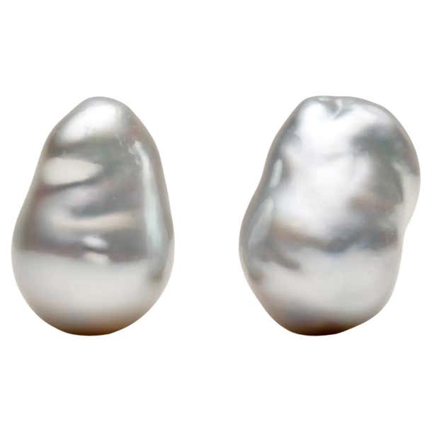 Dangle Earring with Baroque Pearl embellished with blue sapphire In 18k Dangle Earring with Baroque Pearl embellished with blue sapphire In 18k