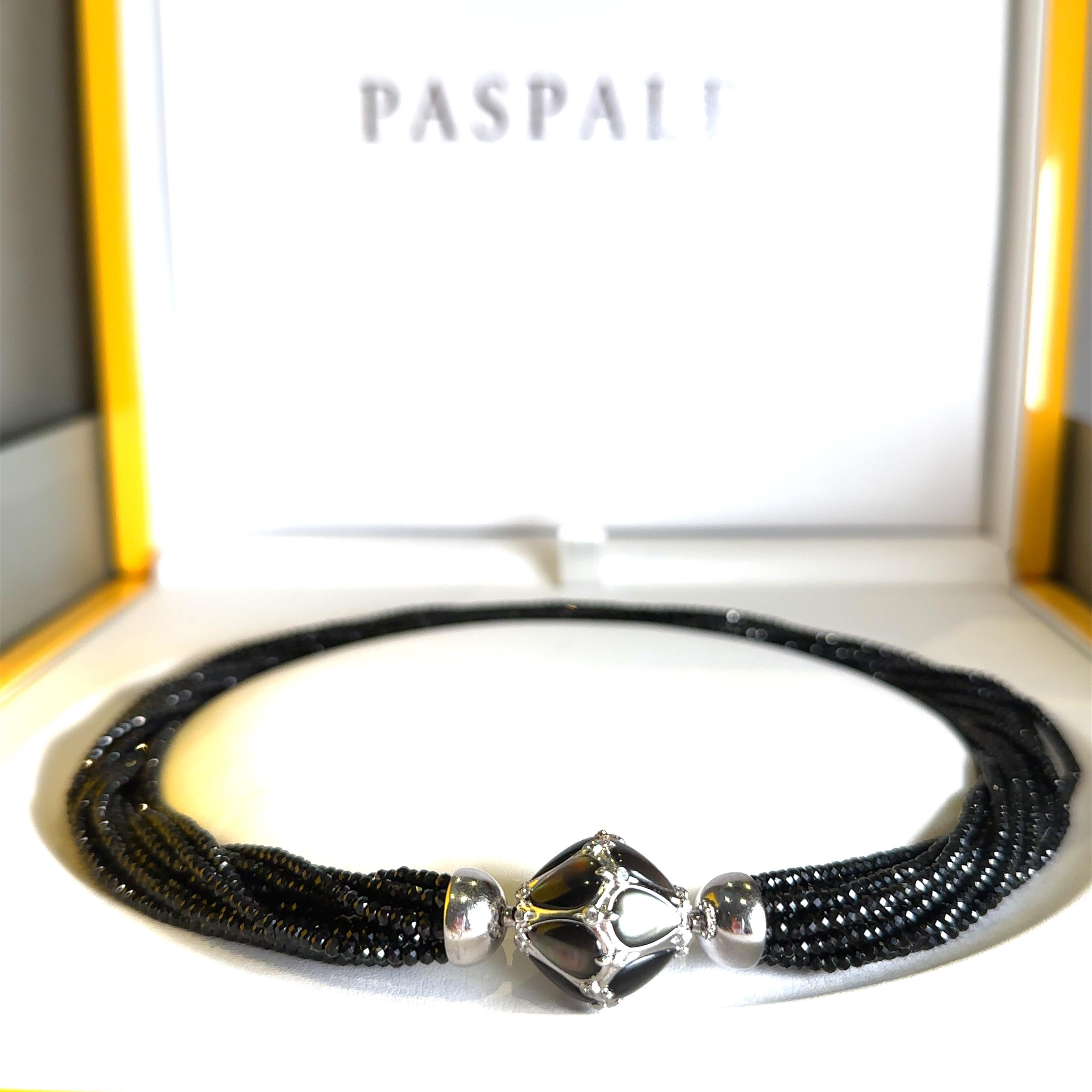 Unique features: 

A Paspaley Black Spinel Necklace with Mother of Pearl Clasp designed with twelve strands of faceted beads terminating to an 18ct White Gold diamond and black mother of pearl clasp.

Metal: 18ct White Gold
Carat: N/A
Colour: