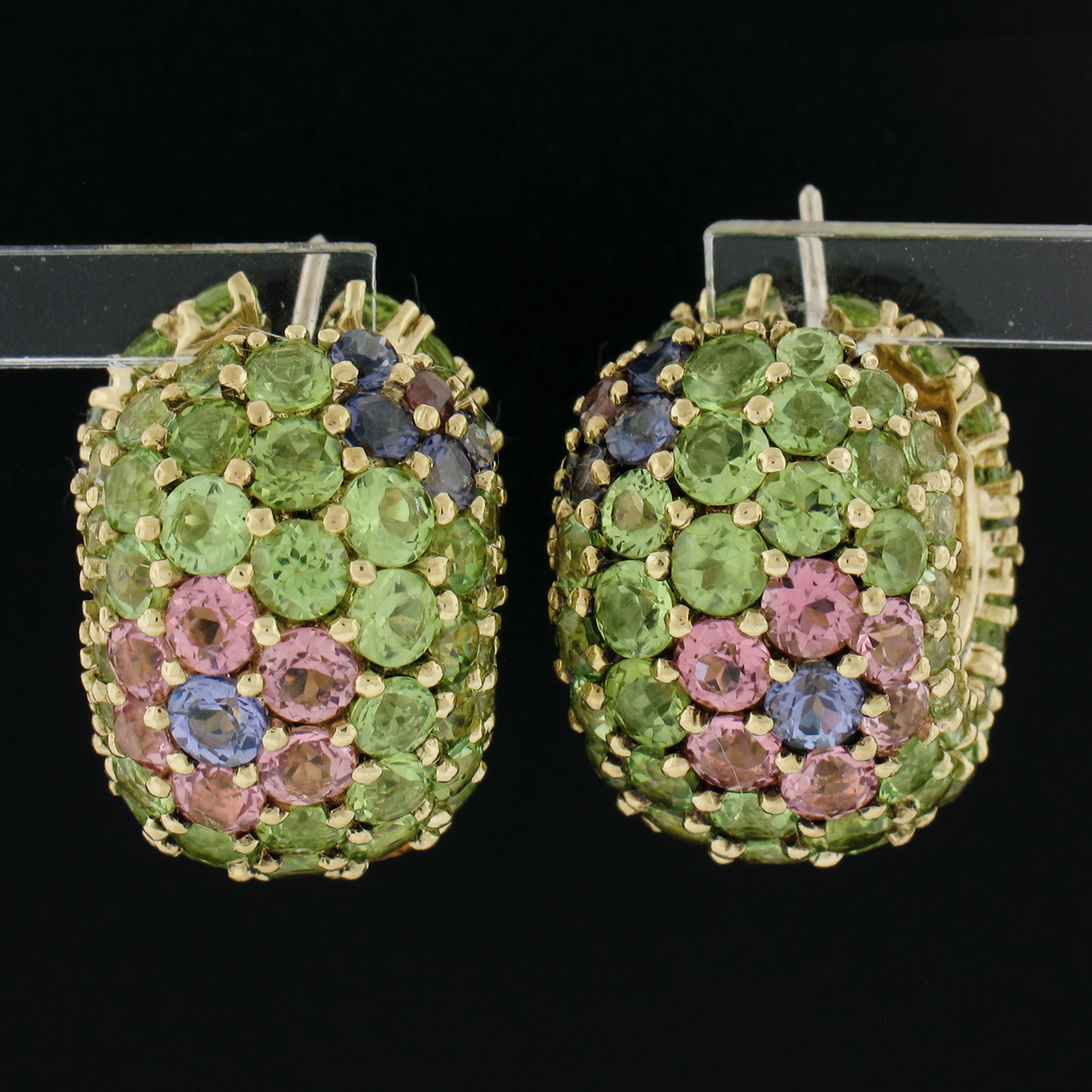 --Stone(s):--
Numerous Natural Genuine Peridots, Amethysts, Citrines, Iolites, & Pink Tourmalines - Round Brilliant Cut - Pave Set - Green, Purple, Orange, Blue & Pink Colors

Material: Solid 18k Yellow Gold
Weight: 23.54 Grams
Backing: Posts w/