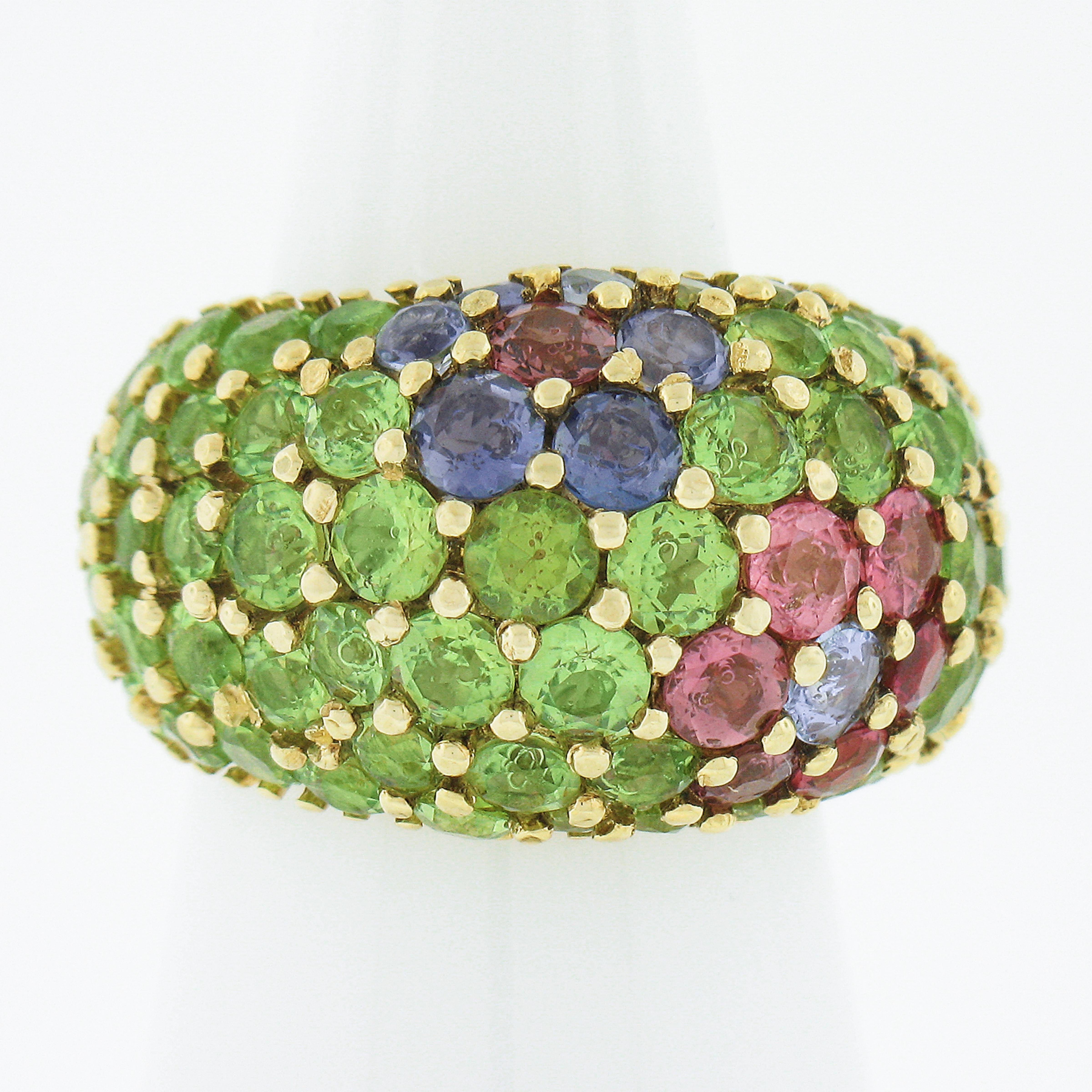 --Stone(s):--
Numerous Natural Genuine Peridots, Iolites & Tourmalines - Round Cut - Shared Prong Set - Lime Green, Violet Purple & Pink Color

Material: Solid 18k Yellow Gold
Material Weight: 16.8 Grams
Ring Size: 6.0 (Fitted on a finger. We can