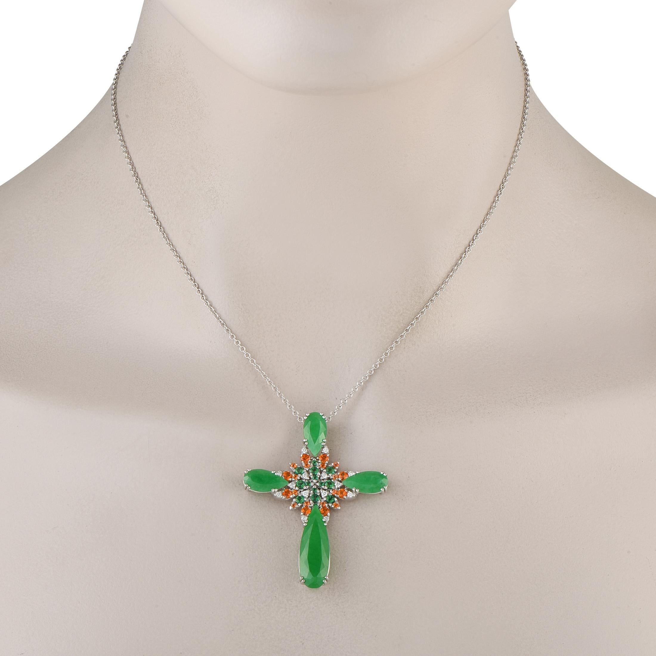 This 18K White Gold Pasquale Bruni necklace offers a colorful take on a traditional cross necklace. Suspended from a 19 chain, it features a cross shaped pendant measuring 1.88 long by 1.50 wide. Vibrant Jade and Garnet stones make it incredibly