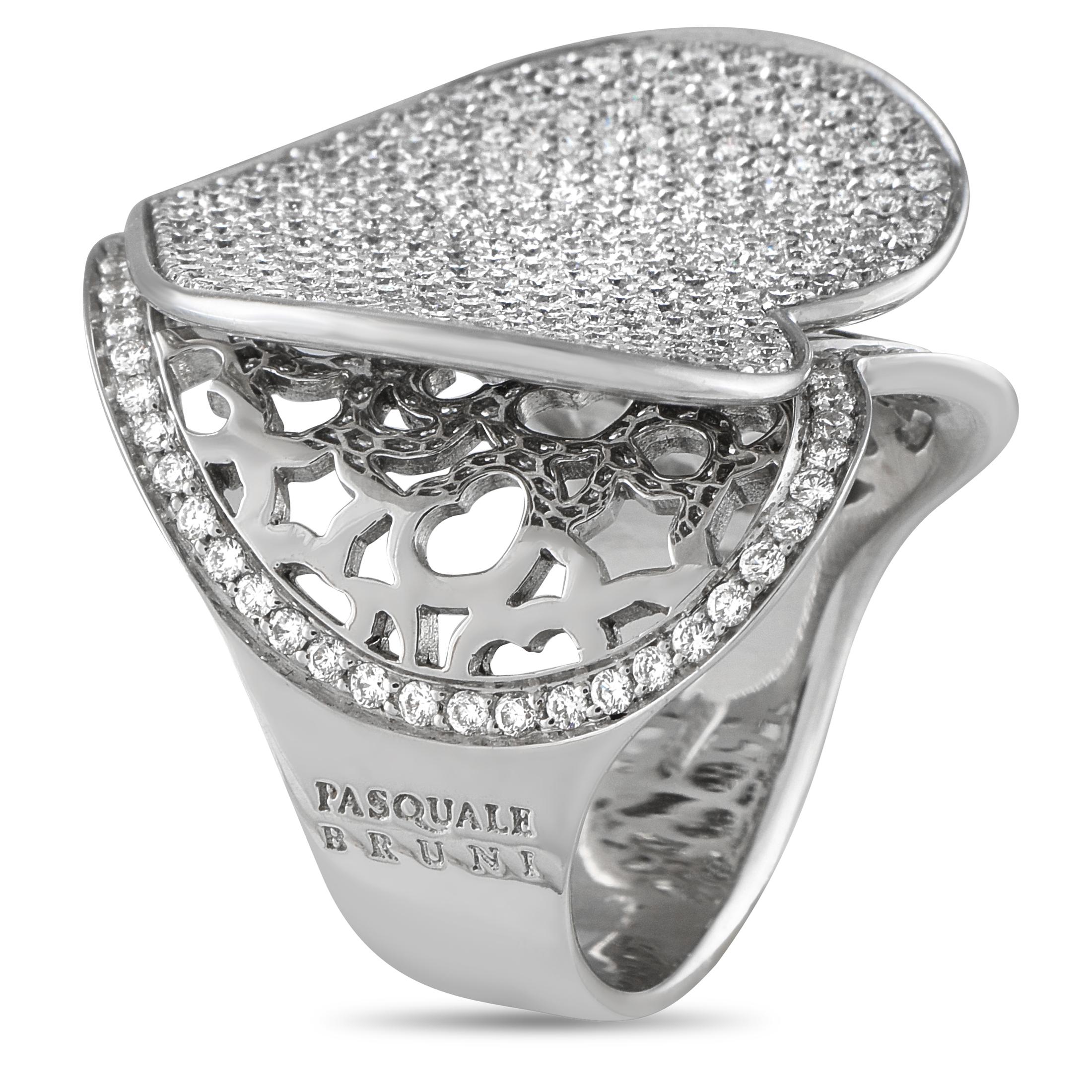 This Pasquale Bruni ring is filled with dramatic details that will capture your imagination. At the center, a gently curved heart motif reveals cut-out metalwork below. Inset Diamonds with a total weight of 2.08 carats further elevate the intricate