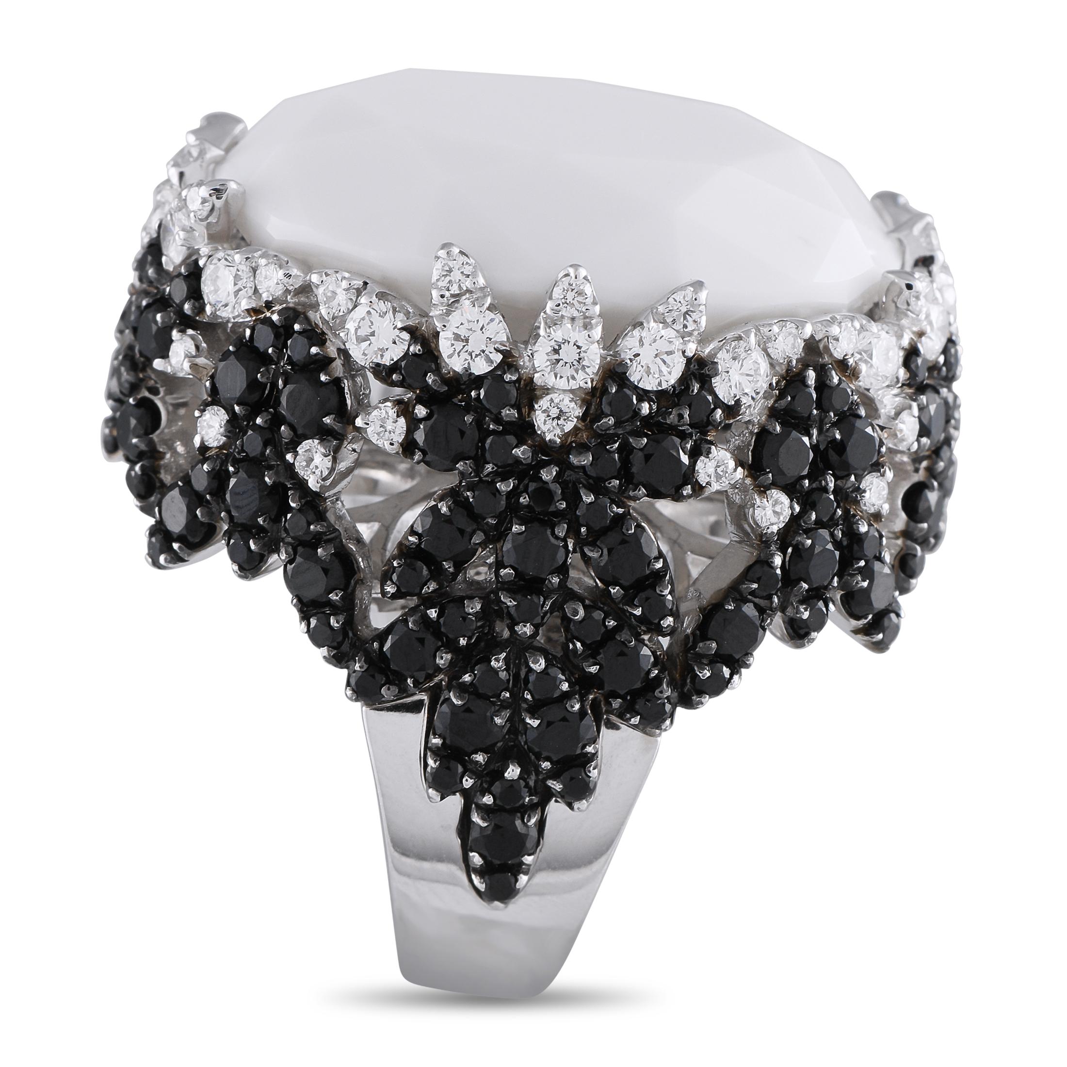 An undeniably opulent design makes this Pasquale Bruni ring a veritable work of wearable art. Crafted using traditional Italian techniques, the ornate 18K White Gold setting perfectly pairs 3.29 carats of black Diamonds with white Diamonds totaling