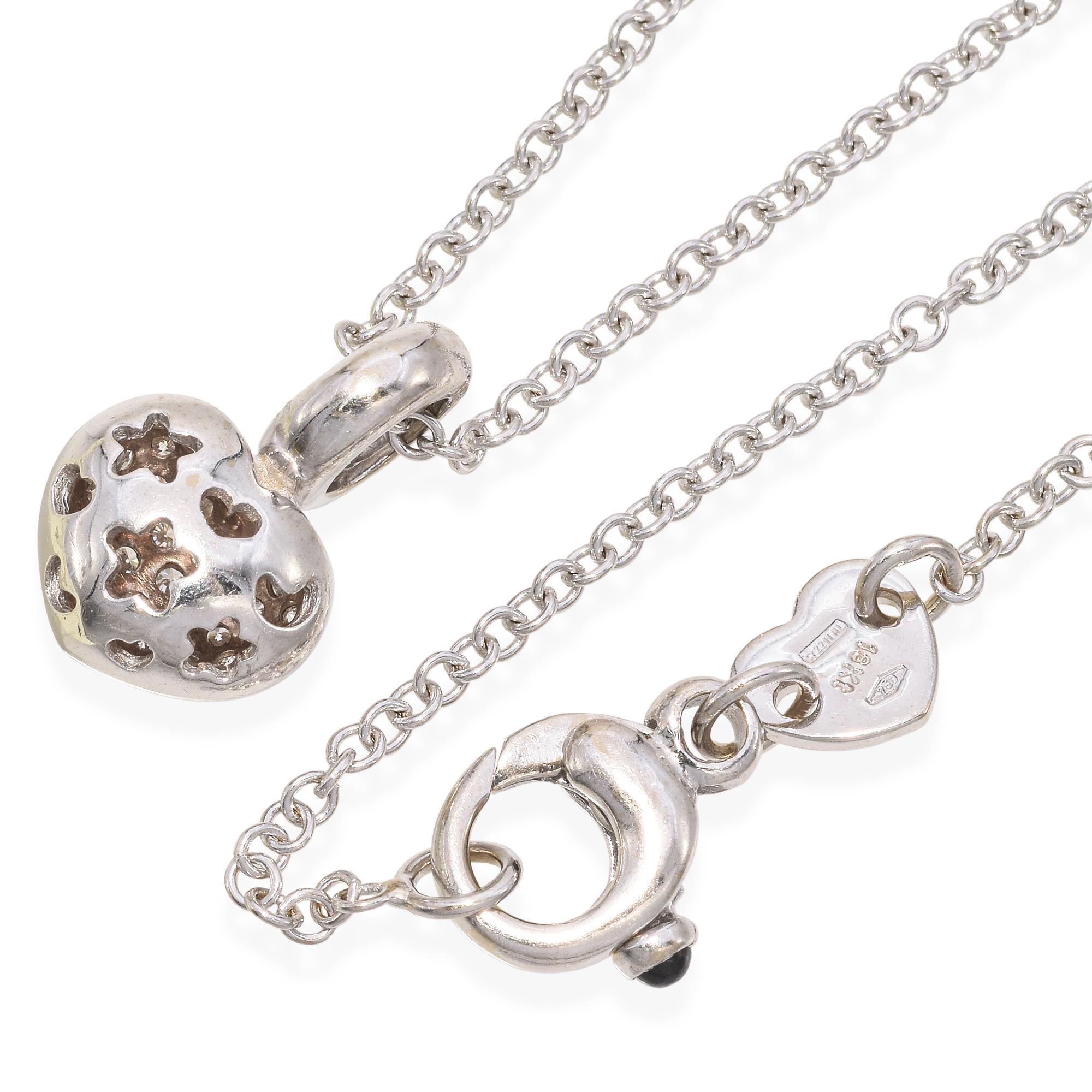 Discover the exquisite charm of this Pasquale Bruni Diamond Heart Pendant Necklace. Crafted from 18K white gold, the necklace showcases approximately 0.46 carats of round-cut white diamonds. The heart-shaped pendant and bail are adorned with pavé