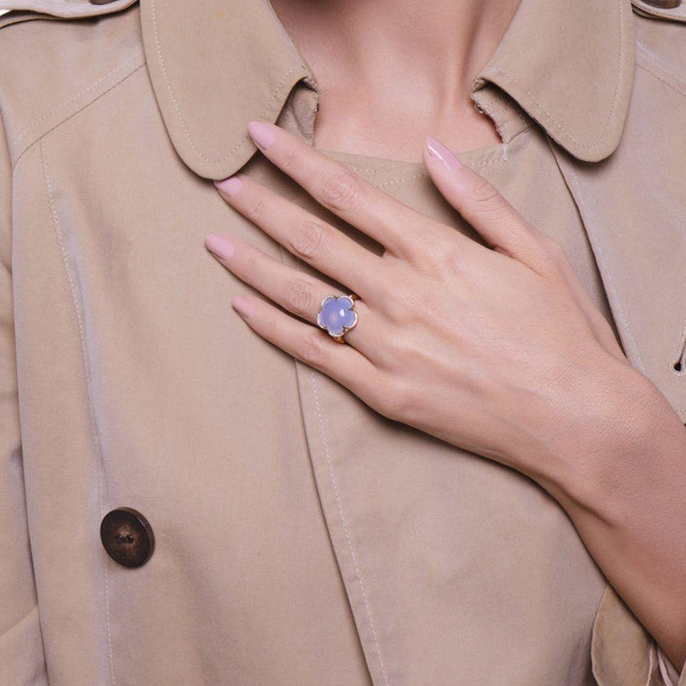 This beautiful ring from the Bon Ton collection by Pasquale Bruni features 18K rose gold adorned with Blue Chalcedony, surrounded with sparkling white diamonds and a feminine floral design. Add to your collection today!

Style: