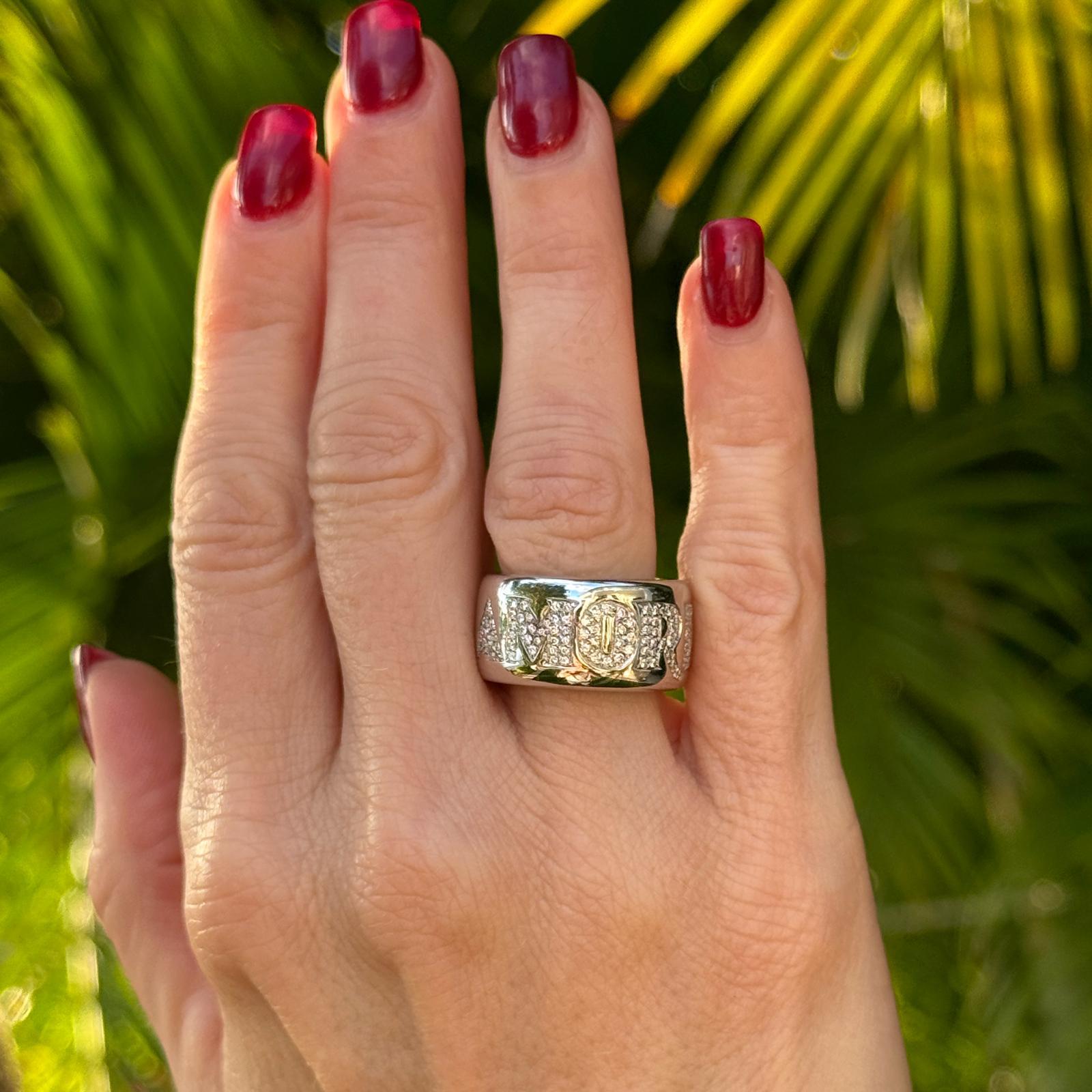 The Pasquale Bruni Amore diamond band ring is a luxurious expression of elegance and craftsmanship, crafted in 18K white gold. Encrusted with 100 round brilliant-cut diamonds totaling approximately 0.70 carats, this ring sparkles with a refined