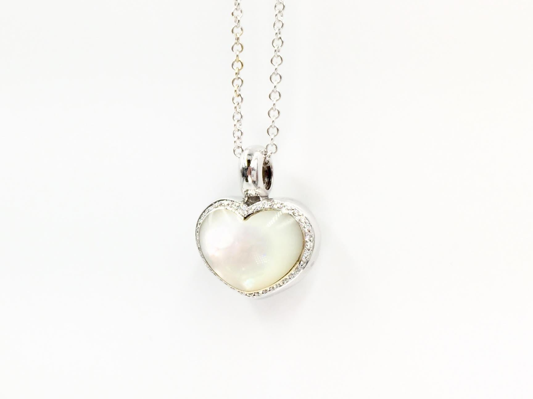 Made in 18 Karat white gold by Italian designer, Pasquale Bruni. This fun ivory mother of pearl and diamond puffed heart pendant is a perfect every day piece. Diamond total weight is .15 carats. Pendant has a width of 17mm and a length of 20mm