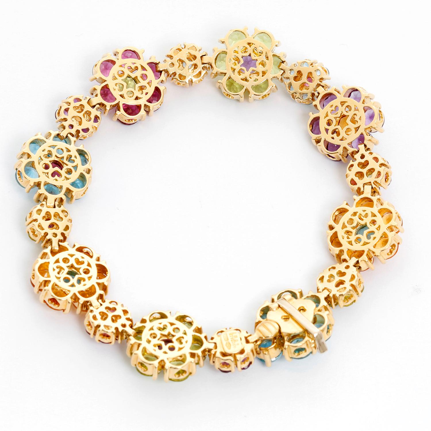 Pasquale Bruni Multistone Floral Bracelet  - Beautiful 18K Yellow gold link bracelet with Topaz, Amethyst, Tourmaline, Citrine, Peridot and iolite flowers. Hallmarked; Makers mark,  750. Total weight 37.2 grams. Wrist size 7 inches .