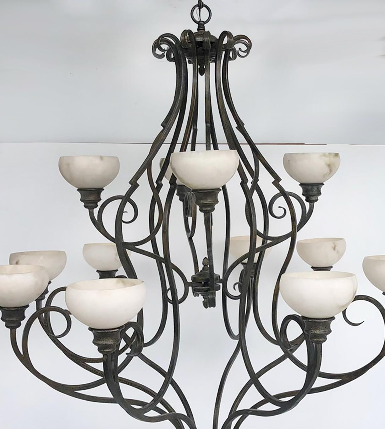 Pasquale Miranda for Feiss Iron and Alabaster Chandelier 20th Century

Offered for sale is a large 12 arm chandelier designed by Pasquale Miranda for Feiss Industries. 
 This large and substantial iron and alabaster stone chandelier makes a strong