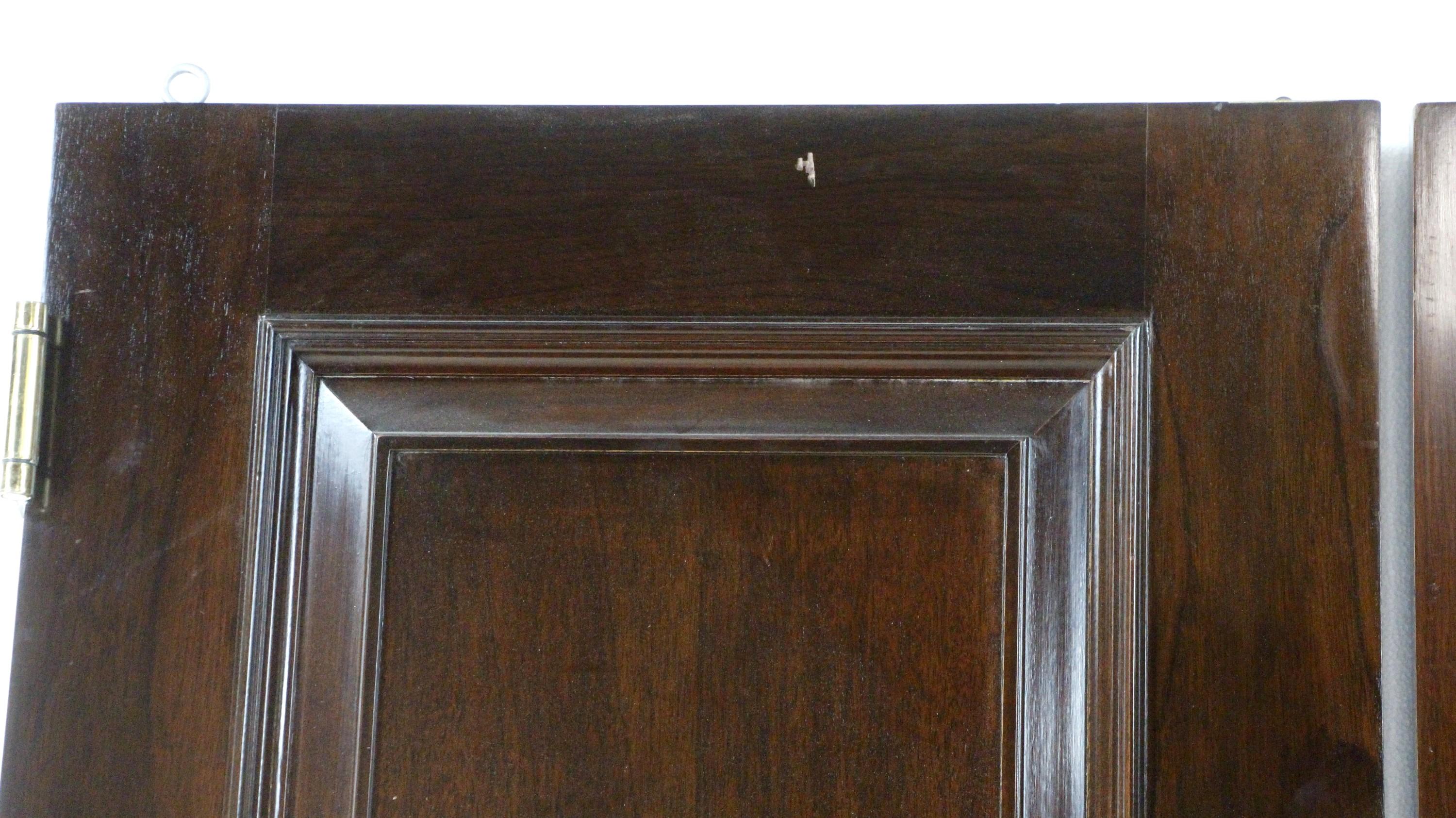 Set of solid wood passage doors with three panes each and a glossy dark tone finish. The original hardware is included. Priced as a double. Measures: 89.5 x 54.