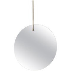 Passage Mirror, a Circular Mirror Made of One-way Mirror and Brushed Brass