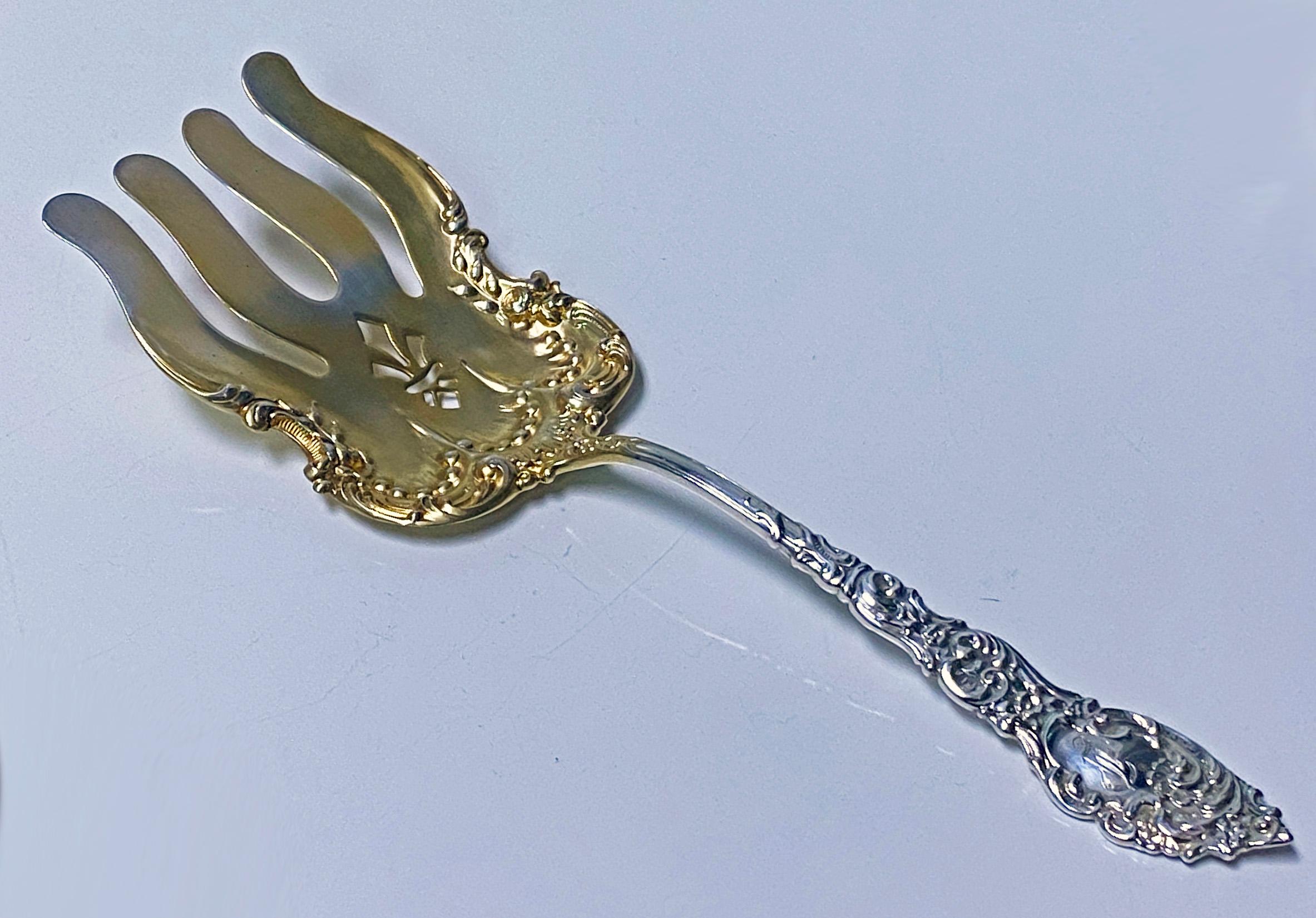 Passaic by Unger sterling silver asparagus fork gold washed circa 1900. Good large Serving Fork, partial gold wash. Length: 8.75 inches. Weight: 81 grams. Very minor wear to original gold wash on tines totally commensurate with age, mentioned purely