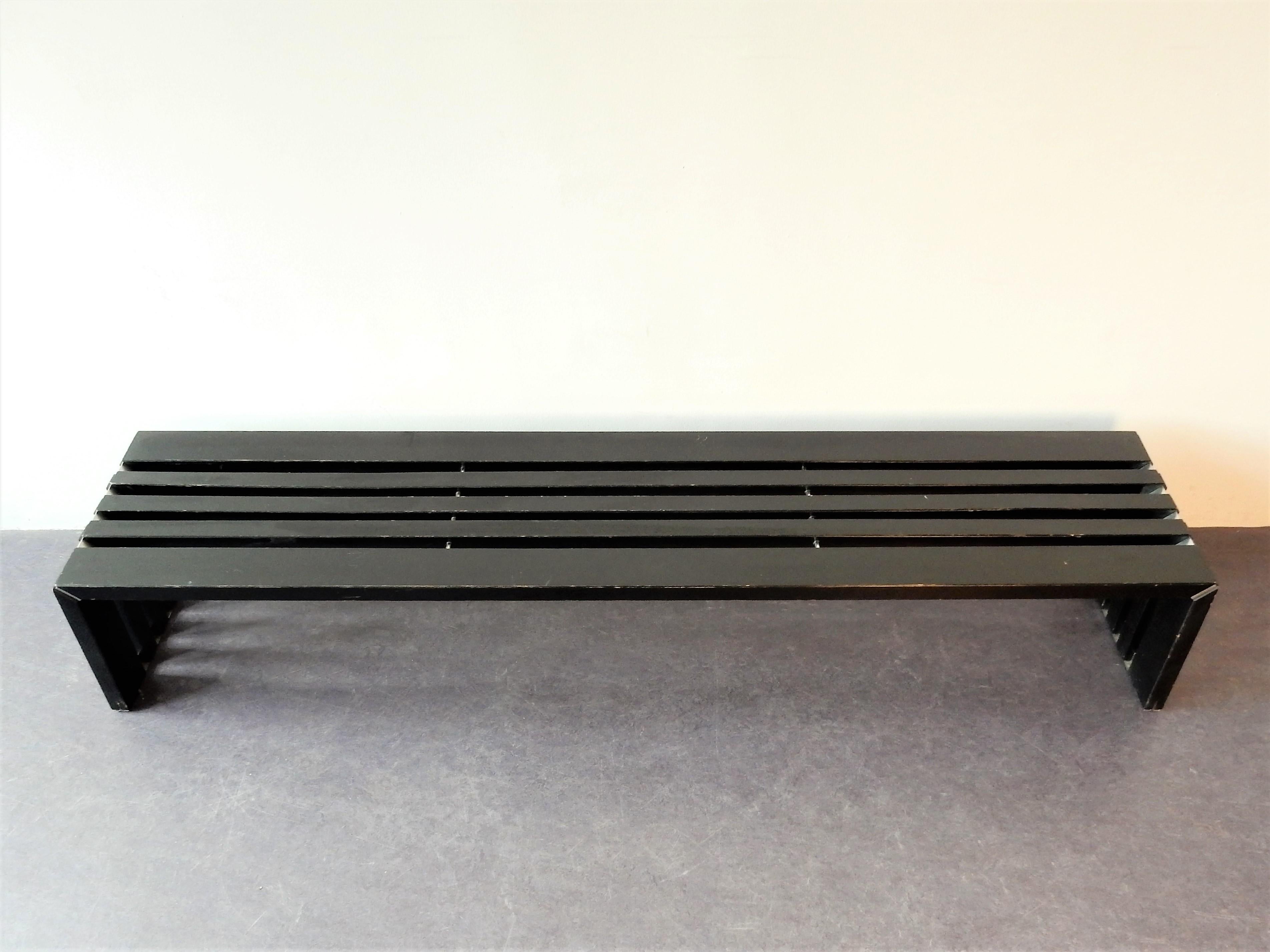 This slatted bench of the ‘Passe Partout’ series was designed by Walter Antonis for Arspect ('t Spectrum) in the Netherlands in the 1970s. It is a nice, heavy model made of black painted wood with stainless steel elements. This item can be used as a