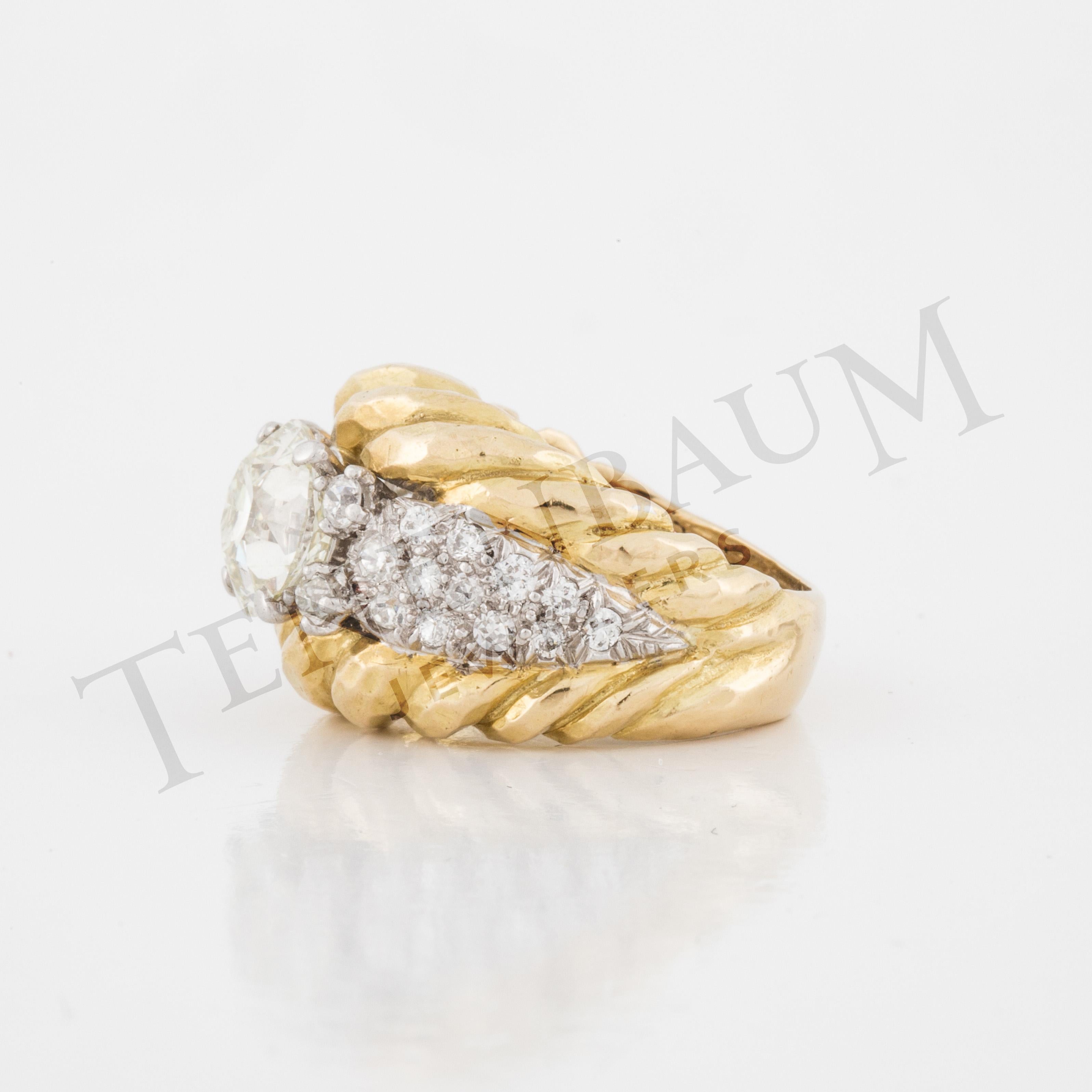 Vintage David Webb 18K yellow gold textured ring with diamonds and rope borders. Ring features one Old European-cut diamond, 2.64 carats, M color, VS1 clarity, accompanied by a GIA report.  Additionally there are single-cut, old European-cut and