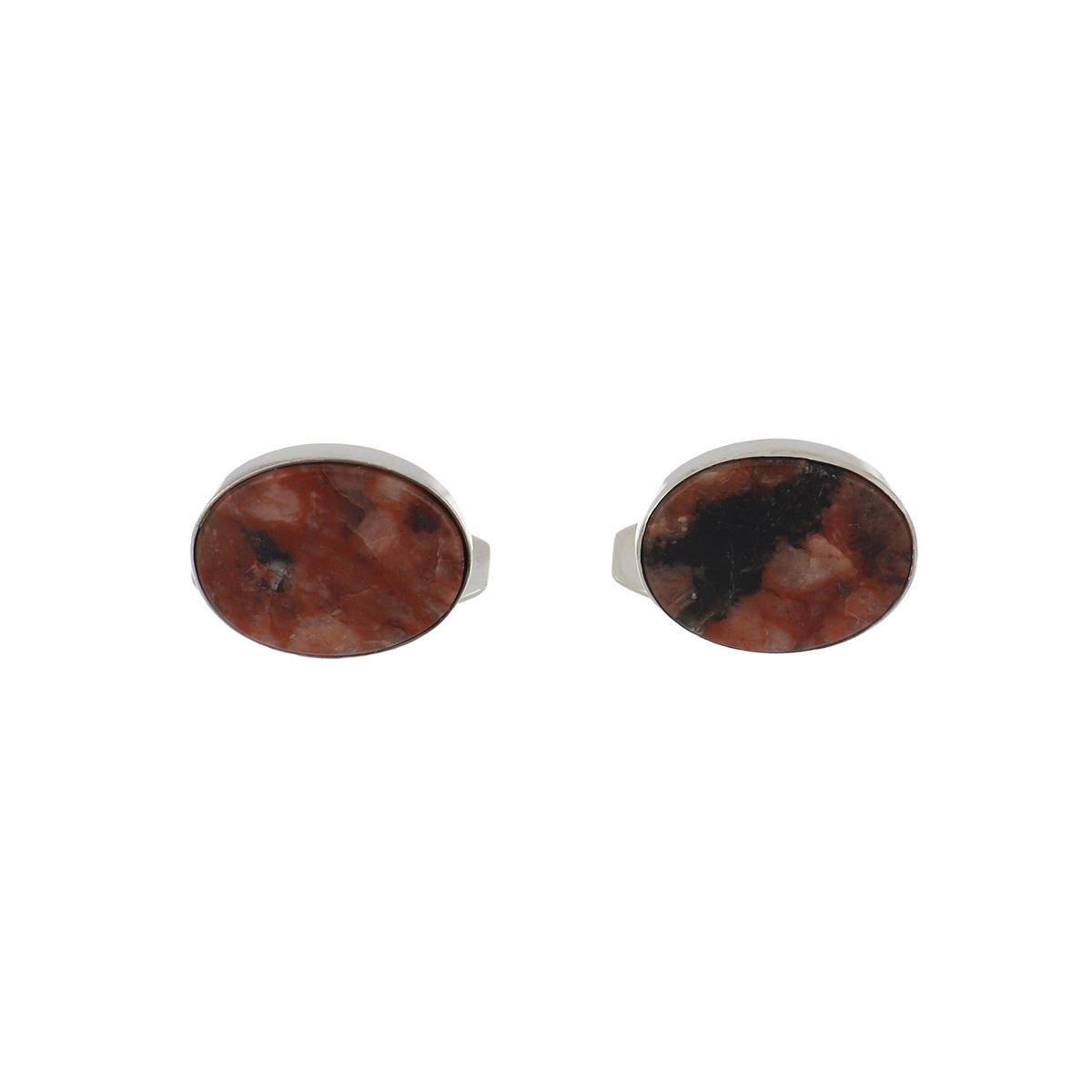 Retro Nels From cufflinks composed of sterling silver and pink granite. Danish, circa 1940.