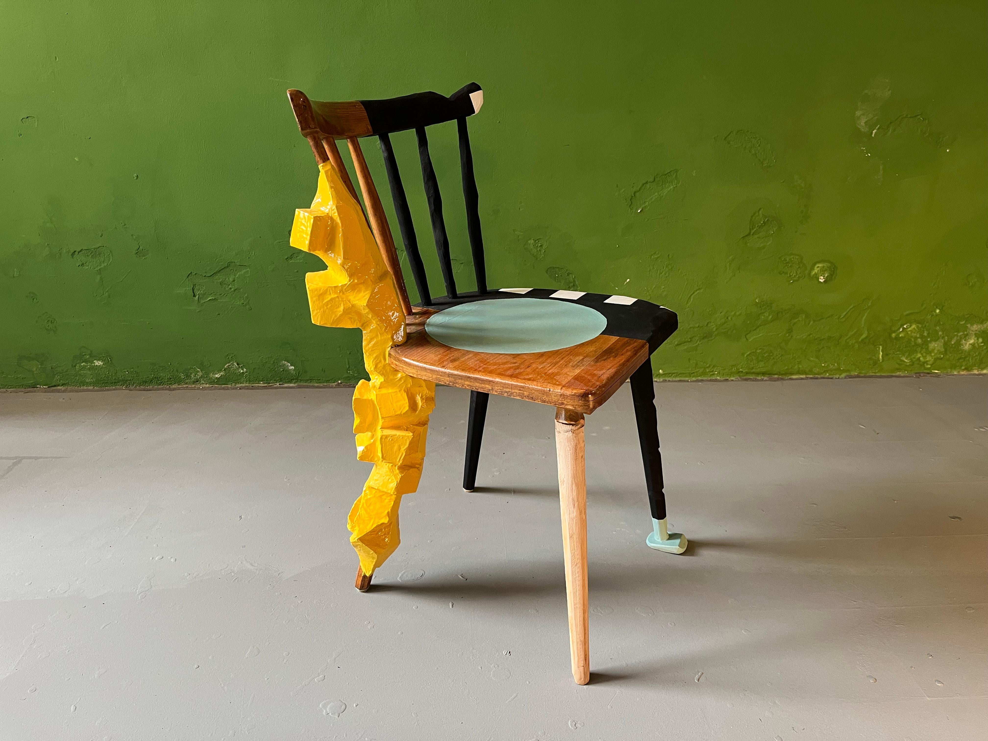 Sculpural design chair. Traditional bavarian kitchen chair contemporized, additional sculpural leg added, re-shaped, painted and multi-lacquered by Markus Friedrich Staab.
You can use this chair on a dailly basis or you can see it as a