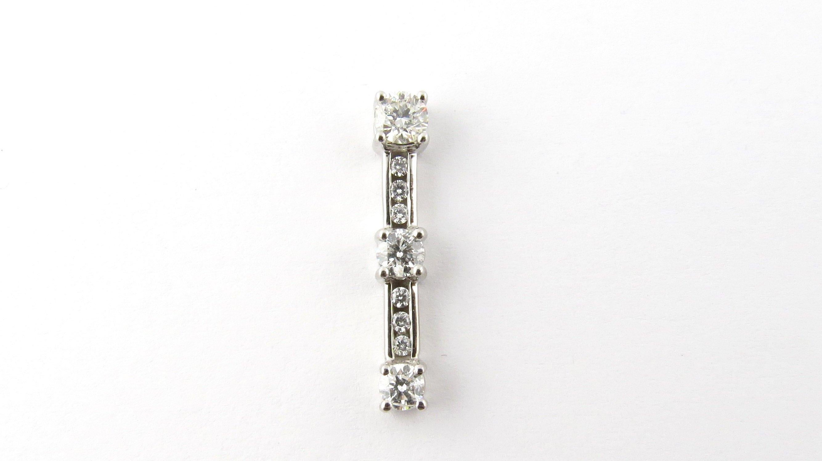 Past Present Future Keepsake 14k Gold Pendant with Diamonds

The pendant measures approx 3 mm x 4 mm x 25 mm.

14k white gold pendant with .72 carats of round brilliant diamonds, I1, H.

This pendant features 1 small diamond .15 cts and measures