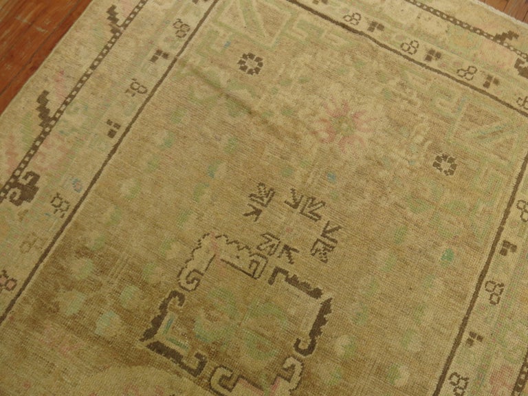 Pastel Antique Khotan Rug with Camel Background For Sale at 1stDibs