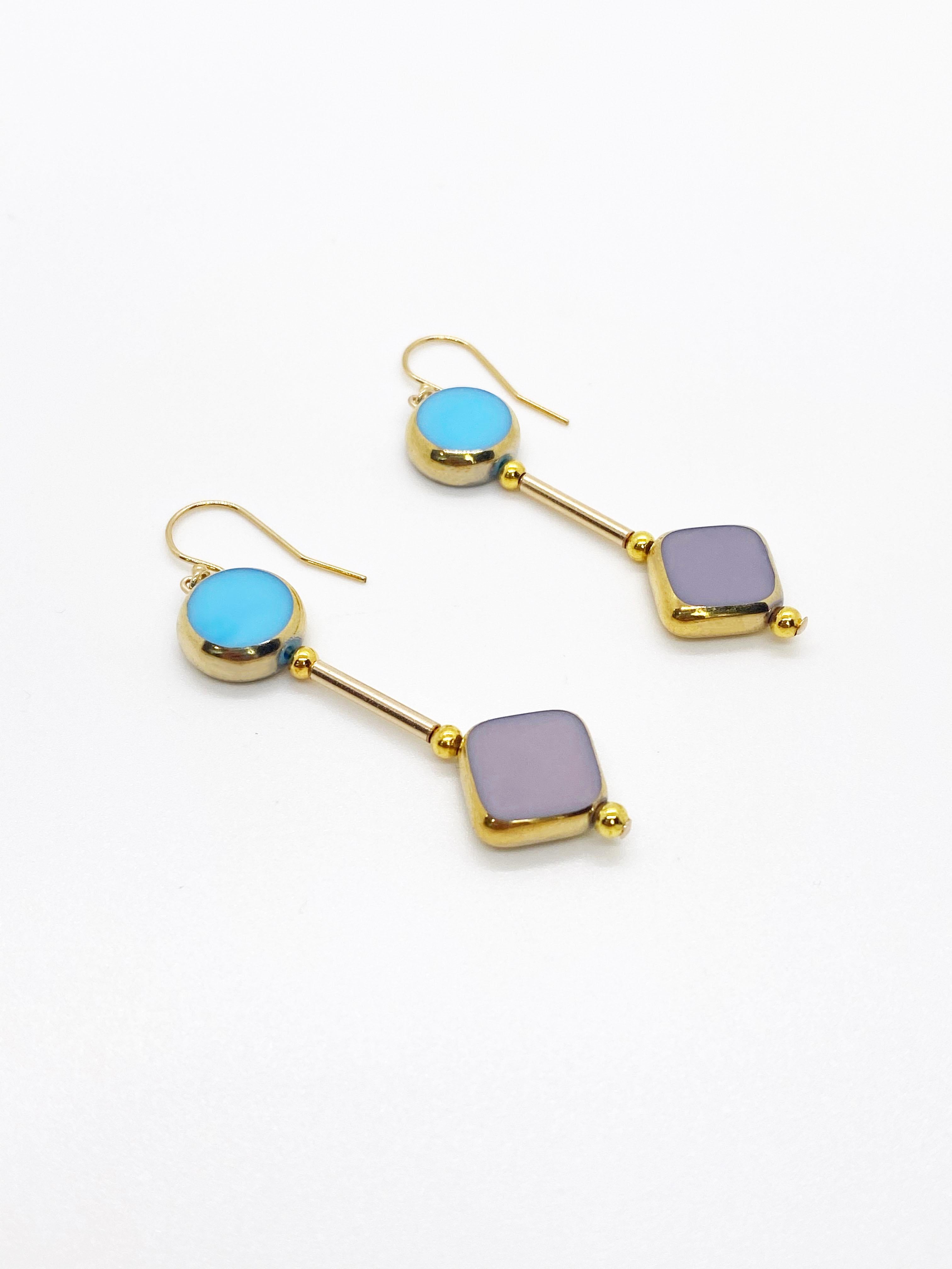 The pastel colors on these earrings are like no other. The beads are German vintage glass beads edged with 24K gold dangles on 14K gold filled metals and earring post.

The German vintage glass beads are considered rare and collectible, circa