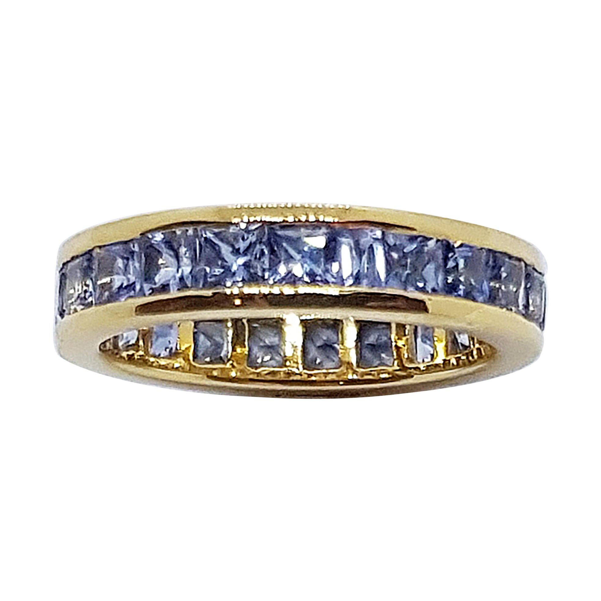 Pastel Blue Sapphire Eternity Ring Set in 18 Karat Gold Settings For Sale