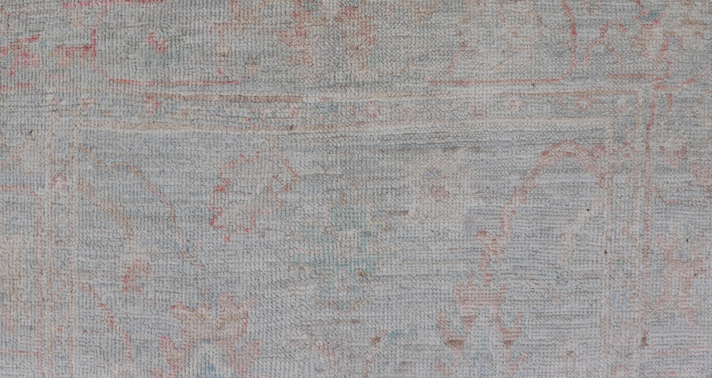 Afghan hand-knotted muted modern Oushak with light blue-gray background
Keivan Woven Arts; rug / AWR-8001 Country of Origin: Afghanistan Type: Oushak Design: All-Over, Floral. 21st century
Measures: 2'11 x 4'11 
This floral piece holds charm