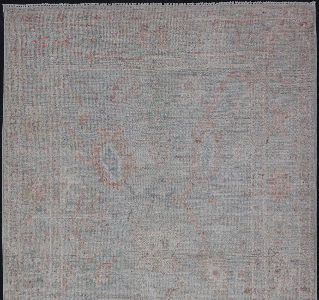 Turkish Pastel Colored Hand-Knotted Modern Oushak with Light Blue-Gray Background For Sale