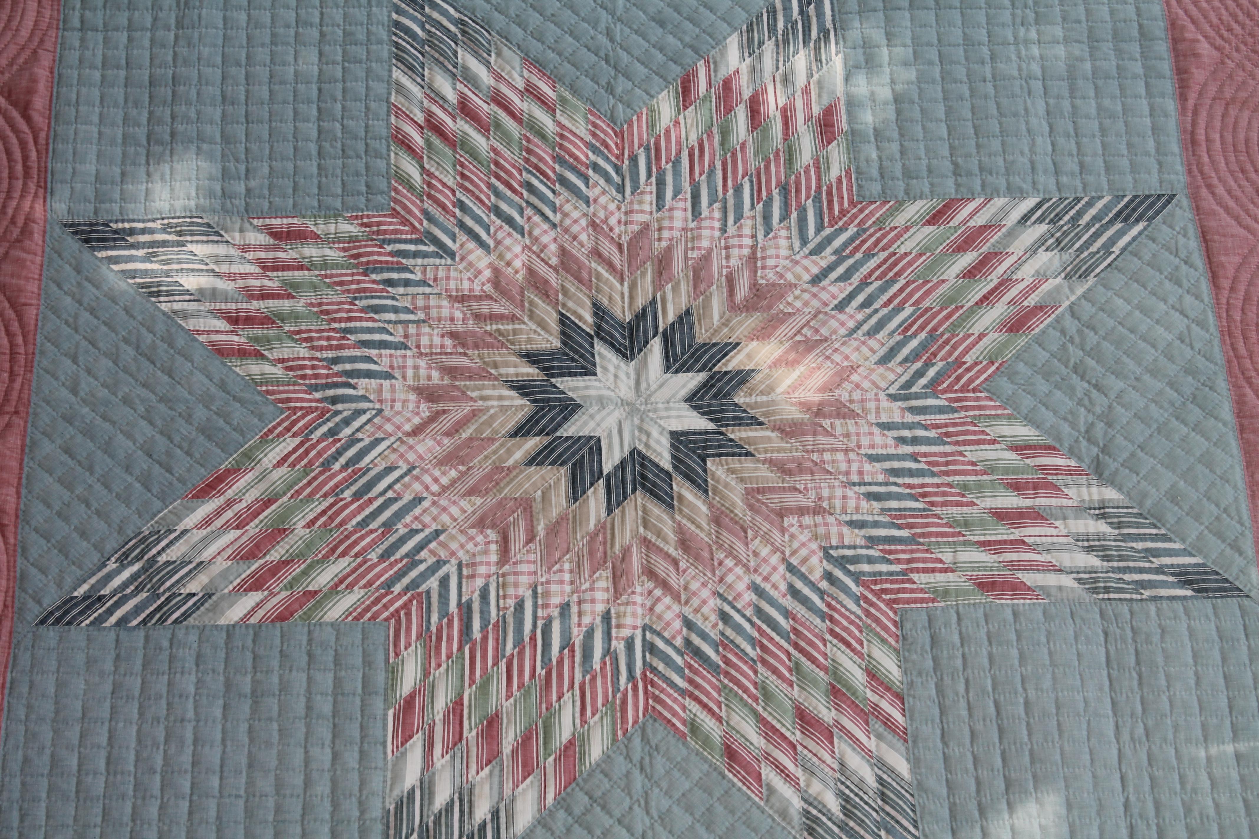 This fantastic pastel star is in fantastic condition and is made from old shirting material.It has a water Mellon red border and backing fabric. The piecing and quilting is fantastic.