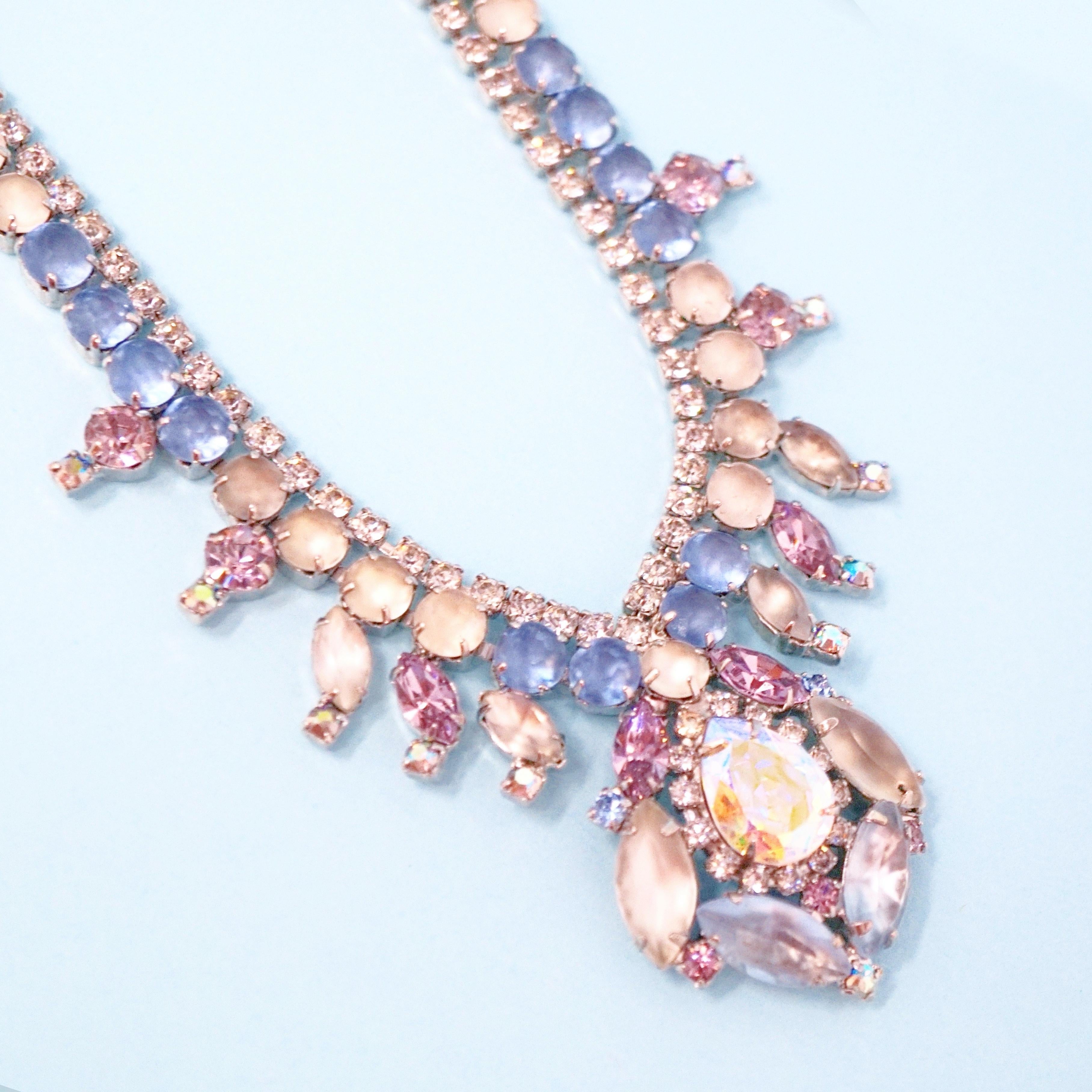 This breathtaking rhinestone necklace by the iconic jewelry brand Hobé is crafted with a pastel palette of rhinestones in dusty rose and sky blue hues.  What makes this piece so unique is the juxtaposition of polished, shiny rhinestones with rare