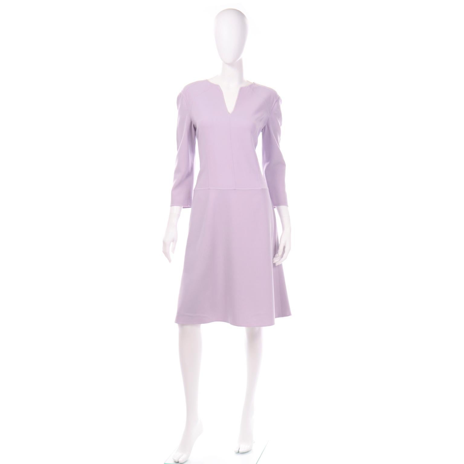 This is a beautiful lavender summer weight wool Carolina Herrera long sleeve dress. The silhouette of this dress is so nicely structured and there is a slight drop waist. The sleeves are slightly cropped depending on your height. This timeless dress