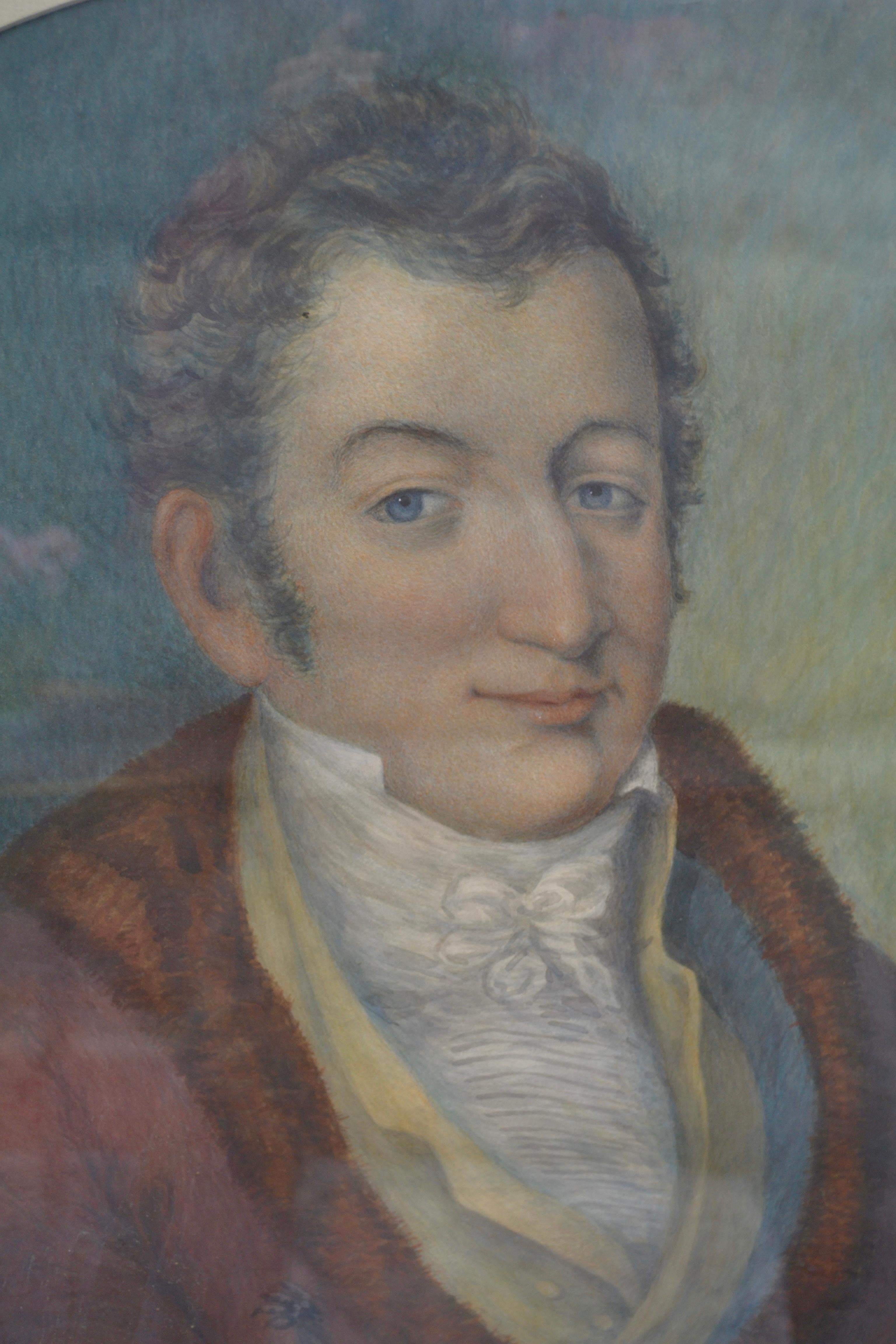 A very well executed early 19th century pastel portrait of a gentleman sitting at his desk. He is portrayed from the waist up, his left hand holding a book. He is dressed in fine clothes his jacket with fur trim. He is likely German or Austrian and