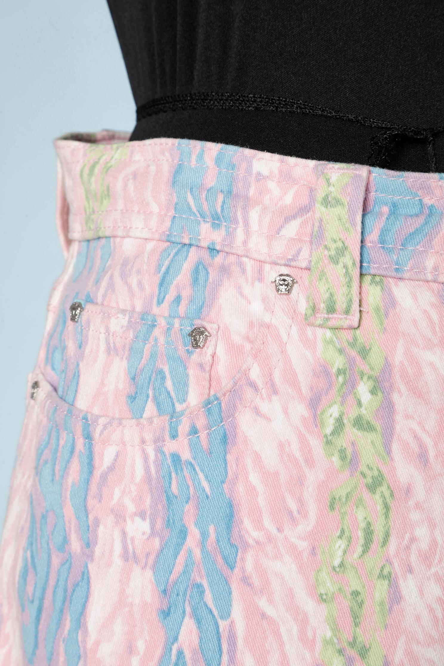 Pastel printed denim pants with Medusa studs and branded buttons. Authentication tag 